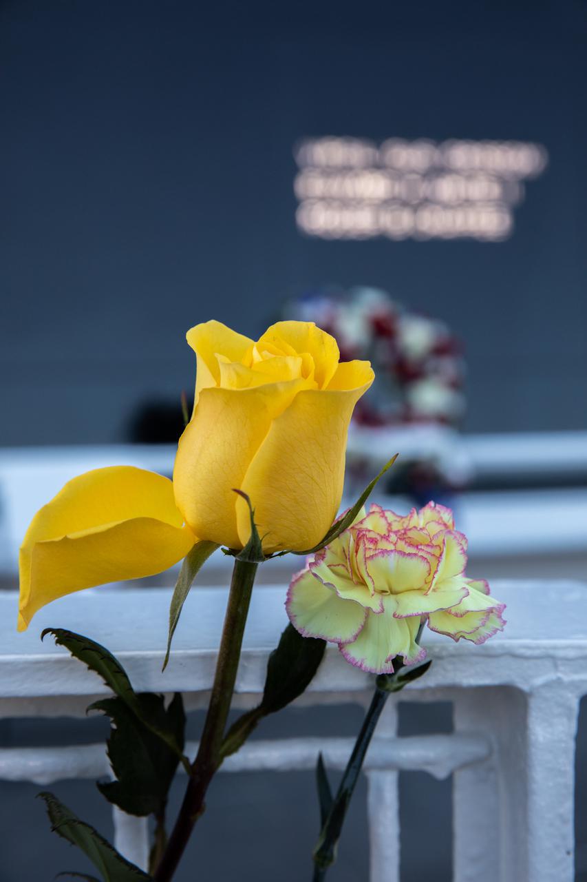 Flowers placed before the Space Mirror Memorial mark NASA’s Day of Remembrance at the Kennedy Space Center Visitor Complex, Jan. 28, 2021. The mirror was dedicated in 1991 to honor all astronauts who lost their lives on missions or during training. During the Day of Remembrance, NASA centers across the country honor those astronauts who have fallen in the pursuit of space exploration.