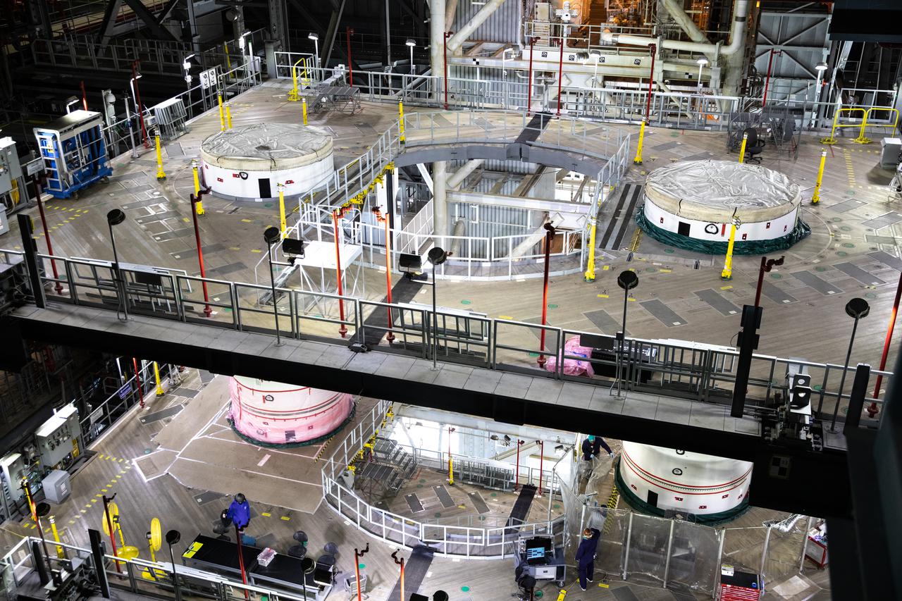 In High Bay 3 of the Vehicle Assembly Building at NASA’s Kennedy Space Center in Florida, the right-hand forward center booster segment for Artemis I is lowered onto the center center booster segment on the mobile launcher for the Space Launch System (SLS) on Feb. 4, 2021. Workers with Exploration Ground Systems and contractor Jacobs teams will stack the twin five-segment boosters on the mobile launcher in High Bay 3 over a number of weeks. When the core stage arrives, it will join the boosters on the mobile launcher, followed by the interim cryogenic propulsion stage and Orion spacecraft. Manufactured by Northrop Grumman in Utah, the twin boosters provide more than 75 percent of the total SLS thrust at launch. The SLS is managed by Marshall Space Flight Center in Huntsville, Alabama. Under the Artemis program, NASA will land the first woman and the next man on the Moon by 2024. The first in a series of increasingly complex missions, Artemis I will test the Orion spacecraft and SLS as an integrated system ahead of crewed flights to the Moon.