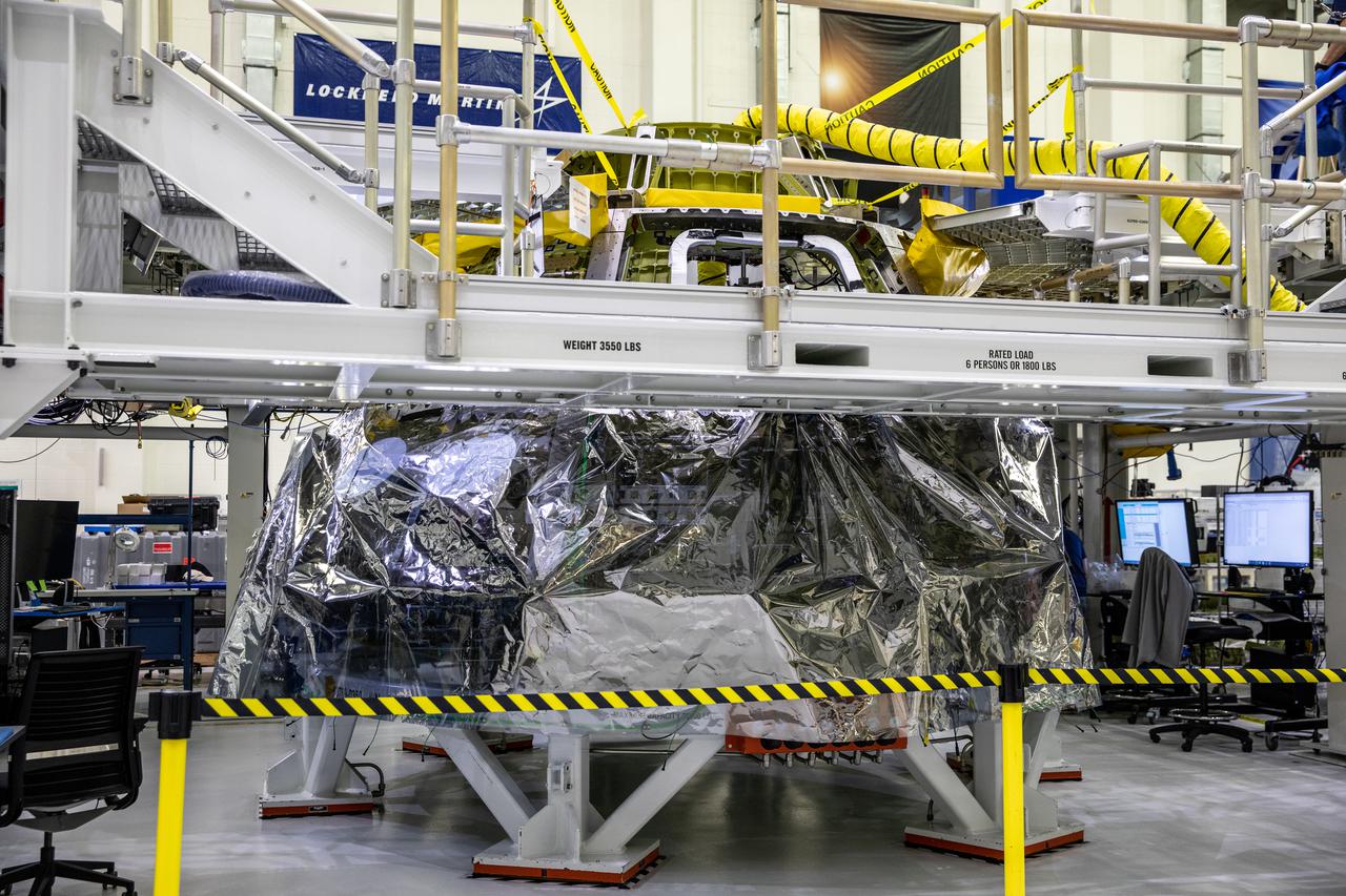 Inside the Neil Armstrong Operations and Checkout Building high bay at NASA's Kennedy Space Center in Florida, assembly continues on Orion’s Artemis II crew module on Feb. 5, 2021. The capsule will house astronauts during its mission around the Moon. Recently, teams removed the spacecraft from its clean room environment, where they have been performing the buildup of the Environmental Control and Propulsion System (ECPS) assemblies prior to their installation into the crew module. It will return to the clean room to complete ECPS final welds and assemblies. Artemis II will confirm all of the Orion spacecraft’s systems operate as designed in the actual environment of deep space with astronauts aboard. As part of the Artemis Program, NASA will send the first woman and next man to the Moon.
