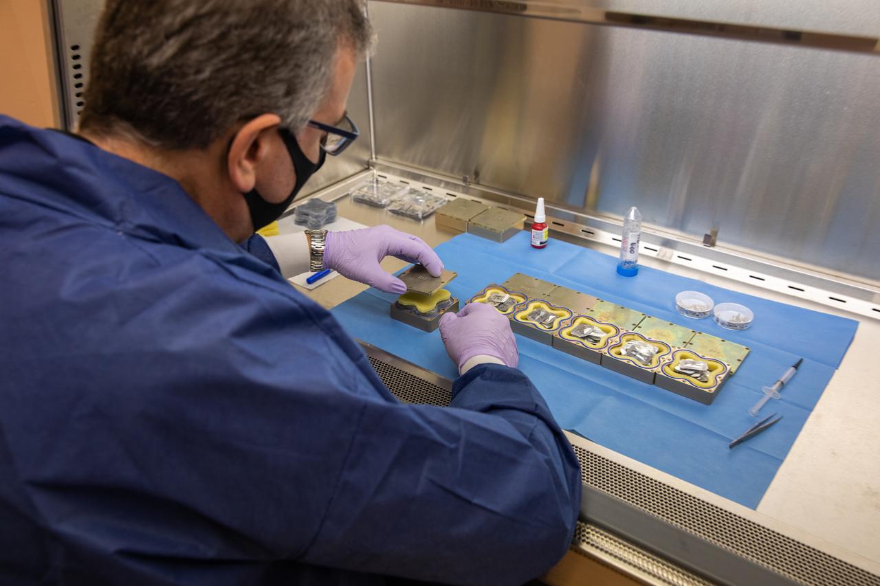 Jeffrey Richards, a project science coordinator working with the Exploration Research and Technology programs at NASA’s Kennedy Space Center in Florida, prepares containers Feb. 11, 2021, for a Materials International Space Station Experiment (MISSE). The containers, carrying sets of seeds, will fly aboard Northrop Grumman’s Cygnus spacecraft as part of NG-15, a NASA commercial resupply mission to the orbiting laboratory targeted for Feb. 20, 2021. They will be placed in the MISSE testing facility, located near the space station’s solar arrays, where they will be exposed to the extreme environment of for six months before returning to Earth for further study.
