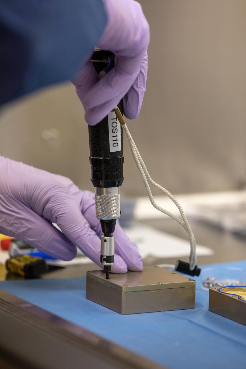 Jeffrey Richards, a project science coordinator working with the Exploration Research and Technology programs at NASA’s Kennedy Space Center in Florida, prepares containers Feb. 11, 2021, for a Materials International Space Station Experiment (MISSE). The containers, carrying sets of seeds, will fly aboard Northrop Grumman’s Cygnus spacecraft as part of NG-15, a NASA commercial resupply mission to the orbiting laboratory targeted for Feb. 20, 2021. They will be placed in the MISSE testing facility, located near the space station’s solar arrays, where they will be exposed to the extreme environment of for six months before returning to Earth for further study.