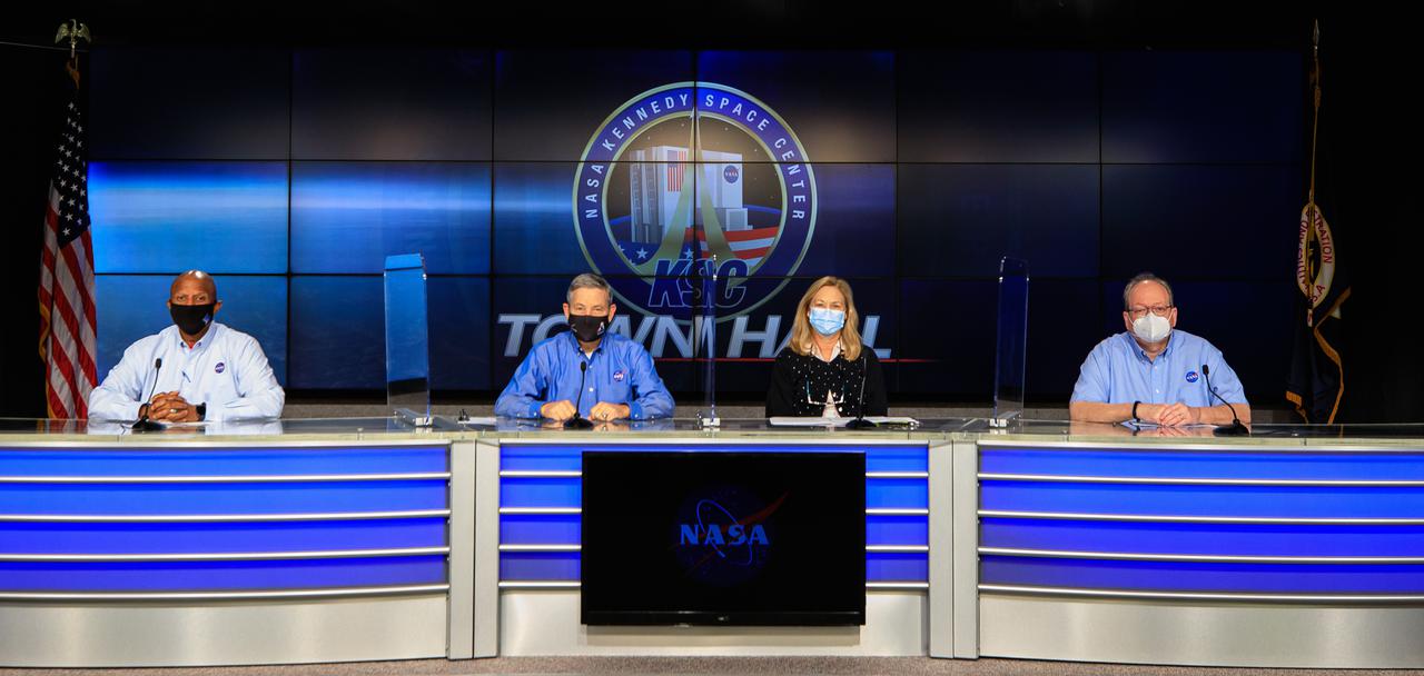 Senior leaders at NASA’s Kennedy Space Center in Florida participate in a virtual town hall hosted at the NASA News Center auditorium on Feb. 17, 2021. From left to right are Kelvin Manning, associate director, technical; Bob Cabana, center director; Janet Petro, deputy director; and Burt Summerfield, associate director, management. The panel addressed a variety of topics and answered questions submitted by the Kennedy workforce.