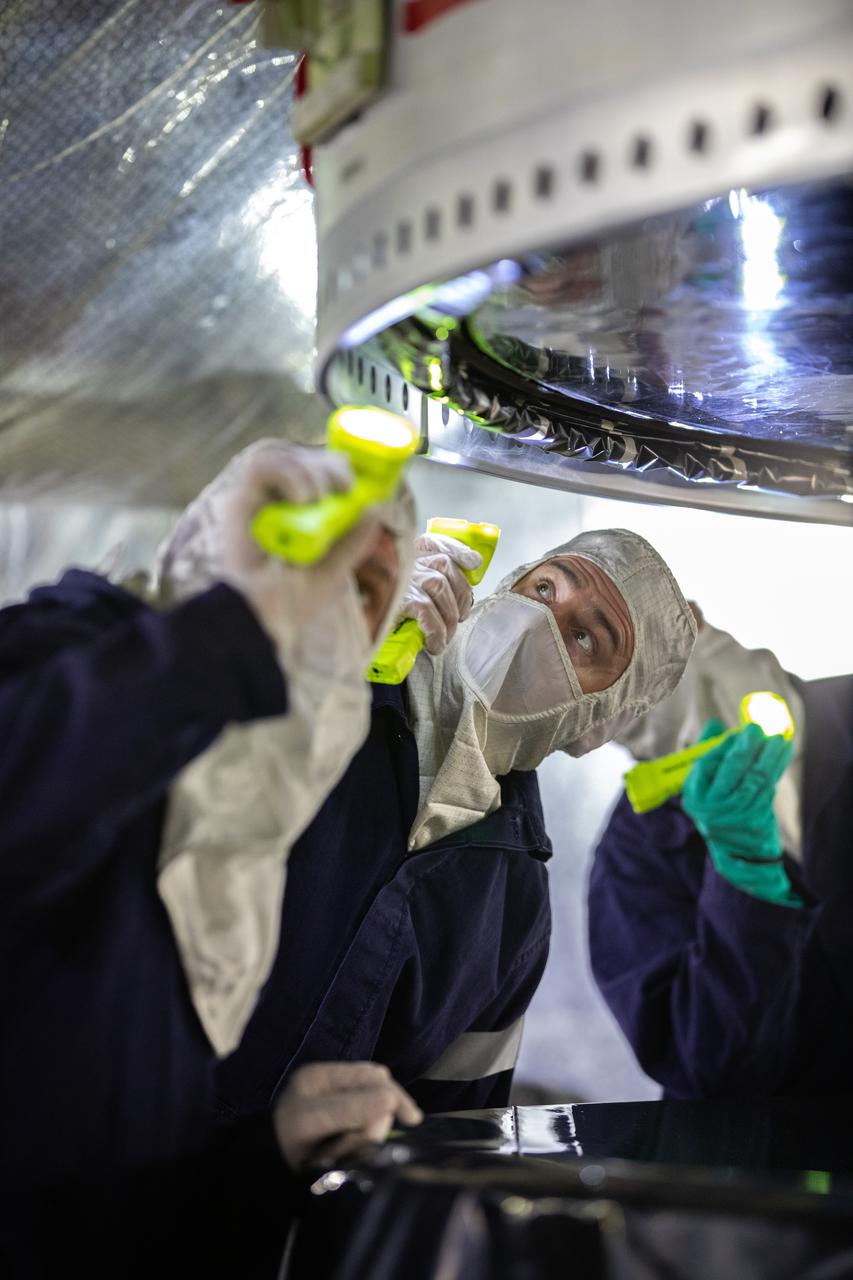 Workers with Exploration Ground Systems and contractor Jacobs teams assist as the right-hand forward segment for NASA’s Space Launch System (SLS) is lowered onto the center forward segment on the mobile launcher in High Bay 3 of the Vehicle Assembly Building at NASA’s Kennedy Space Center in Florida on Feb. 23, 2021. Stacking of the twin five-segment boosters on the mobile launcher is nearing completion. When the core stage arrives, it will join the boosters on the mobile launcher, followed by the interim cryogenic propulsion stage and Orion spacecraft. Manufactured by Northrop Grumman in Utah, the twin boosters provide more than 75 percent of the total SLS thrust at launch. The SLS is managed by Marshall Space Flight Center in Huntsville, Alabama. Under the Artemis program, NASA will land the first woman and the next man on the Moon by 2024. The first in a series of increasingly complex missions, Artemis I will test the Orion spacecraft and SLS as an integrated system ahead of crewed flights to the Moon.