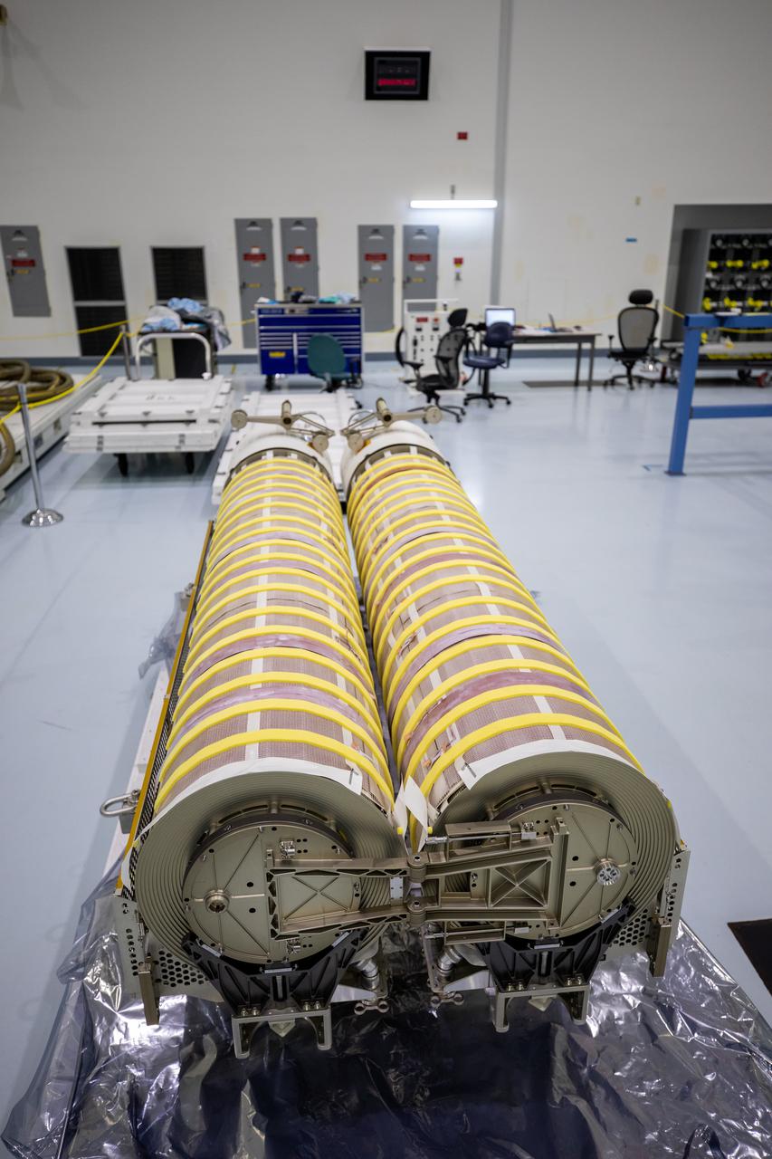 In view are the first two of six solar arrays shortly before NASA and Boeing workers began lifting them into flight support equipment the Space Station Processing Facility at NASA’s Kennedy Space Center in Florida on April 2, 2021. The 63- by- 20-foot solar arrays will launch to the International Space Station later this year. The six new solar arrays in total will produce more than 120 kilowatts of electricity from the Sun’s energy, enough to power more than 40 average U.S. homes. Combined with the eight original, larger arrays, this advanced hardware will provide 215 kilowatts of energy, a 20 to 30 percent increase in power, helping maximize the space station’s capabilities for years to come. The arrays will produce electricity to sustain the station’s systems and equipment, plus augment the electricity available to continue a wide variety of public and private experiments and research in the microgravity environment of low-Earth orbit.