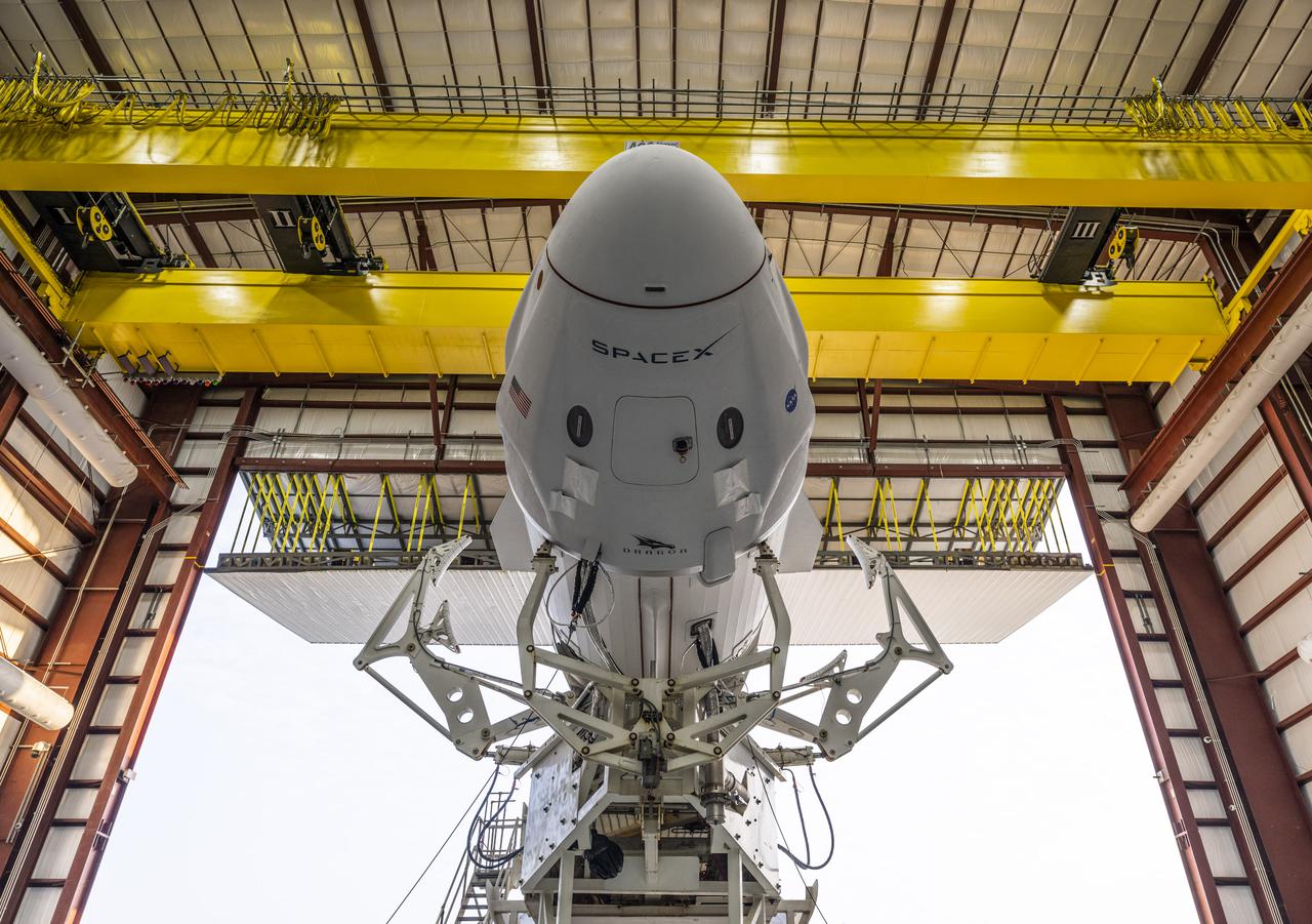 SpaceX’s Crew Dragon “Endeavour,” atop the company’s Falcon 9 rocket, leaves the SpaceX integration hangar adjacent to NASA Kennedy Space Center’s Launch Complex 39A for rollout to the launch pad on April 16, 2021. NASA astronauts Shane Kimbrough and  Megan McArthur, JAXA astronaut Akihiko Hoshide, and ESA astronaut Thomas Pesquet, who arrived at Kennedy on April 16, will fly to the International Space Station on NASA’s SpaceX Crew-2 mission. Liftoff is targeted for Thursday, April 22, at 6:11 a.m. EDT.