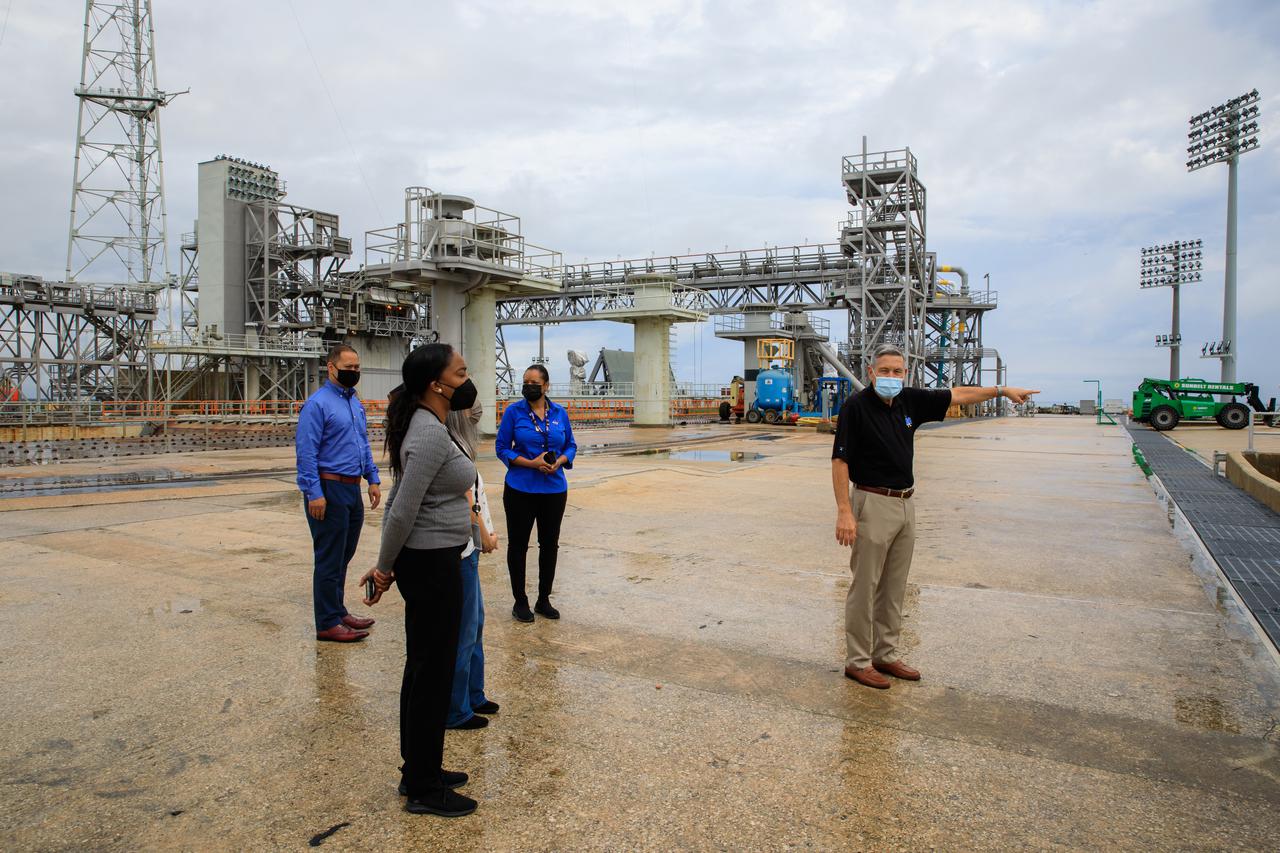 Senior leaders with Kennedy Space Center in Florida, familiarize newly appointed officials from NASA Headquarters with the center’s facilities during a tour on April 19, 2021. The group is on the surface of Launch Complex 39B, where the launch of NASA’s Space Launch System (SLS) rocket and Orion spacecraft will lift off on Artemis missions. Artemis I will be the first integrated test of SLS and Orion and will pave the way for landing the first woman and first person of color on the lunar surface. It will be a proving ground for deep space exploration, leading the agency’s efforts under the Artemis program for a sustainable presence on the Moon and preparing for human missions to Mars.
