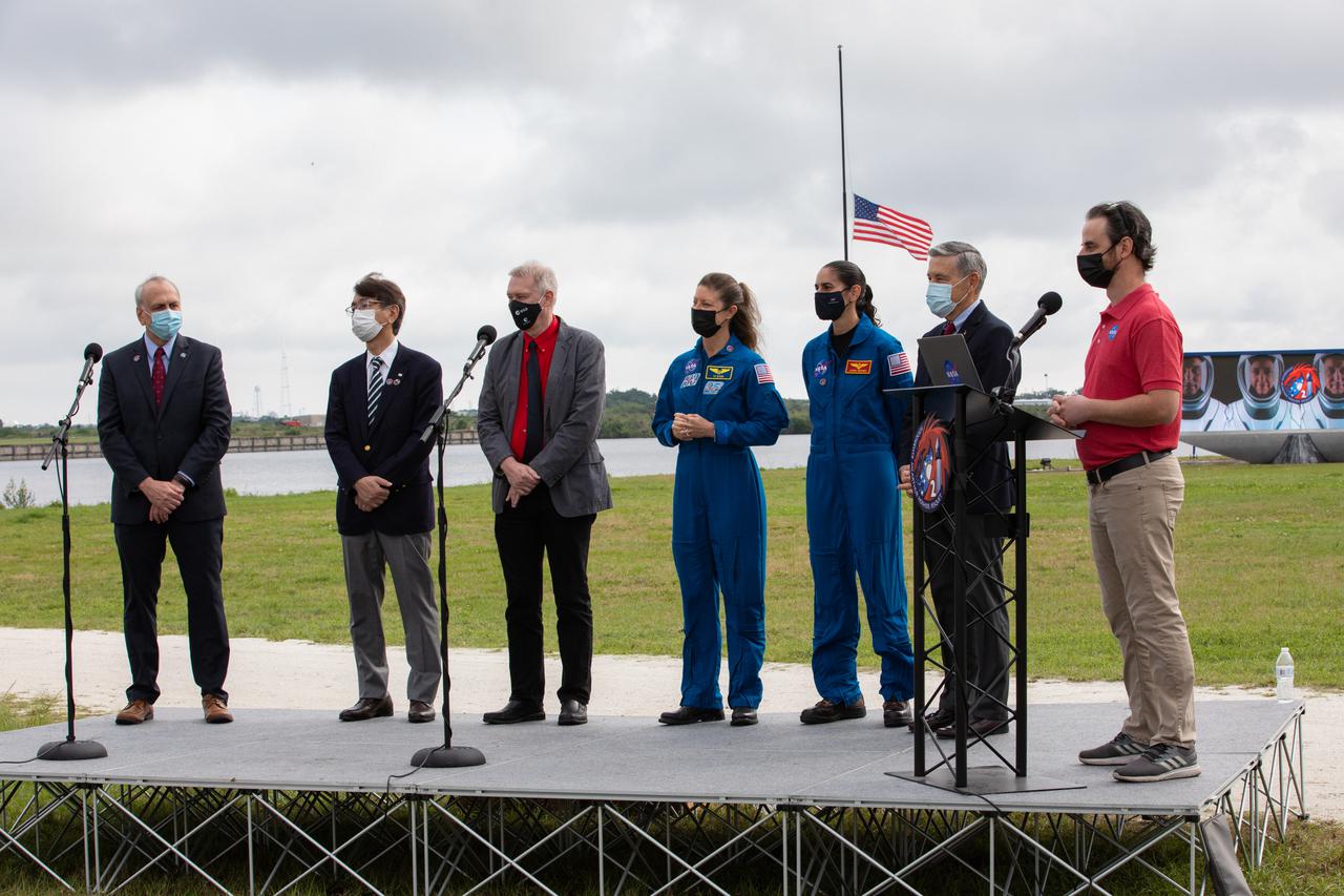 At right, moderator Joshua Santora, NASA Communications, addresses the audience during a NASA Social Facebook Live event held April 21, 2021, near the Press Site countdown clock at NASA’s Kennedy Space Center in Florida, ahead of the agency’s SpaceX Crew-2 launch. Participants, from left to right, are: Steve Jurczyk, acting NASA administrator; Hiroshi Sasaki, vice president and director general, JAXA’s Human Spaceflight Technology Directorate; Frank de Winne, manager, International Space Station Program, ESA; NASA astronauts Tracy Caldwell Dyson and Jasmin Moghbeli; and Kennedy Director Bob Cabana. Crew-2 is the second regular crew mission of a U.S. commercial spacecraft with astronauts to the International Space Station as part of NASA’s Commercial Crew Program. The SpaceX Crew Dragon Endeavour capsule will launch atop the company’s Falcon 9 rocket from Launch Complex 39A to the space station for a six-month science mission. Liftoff is targeted for Friday, April 23, at 5:49 a.m. EDT.