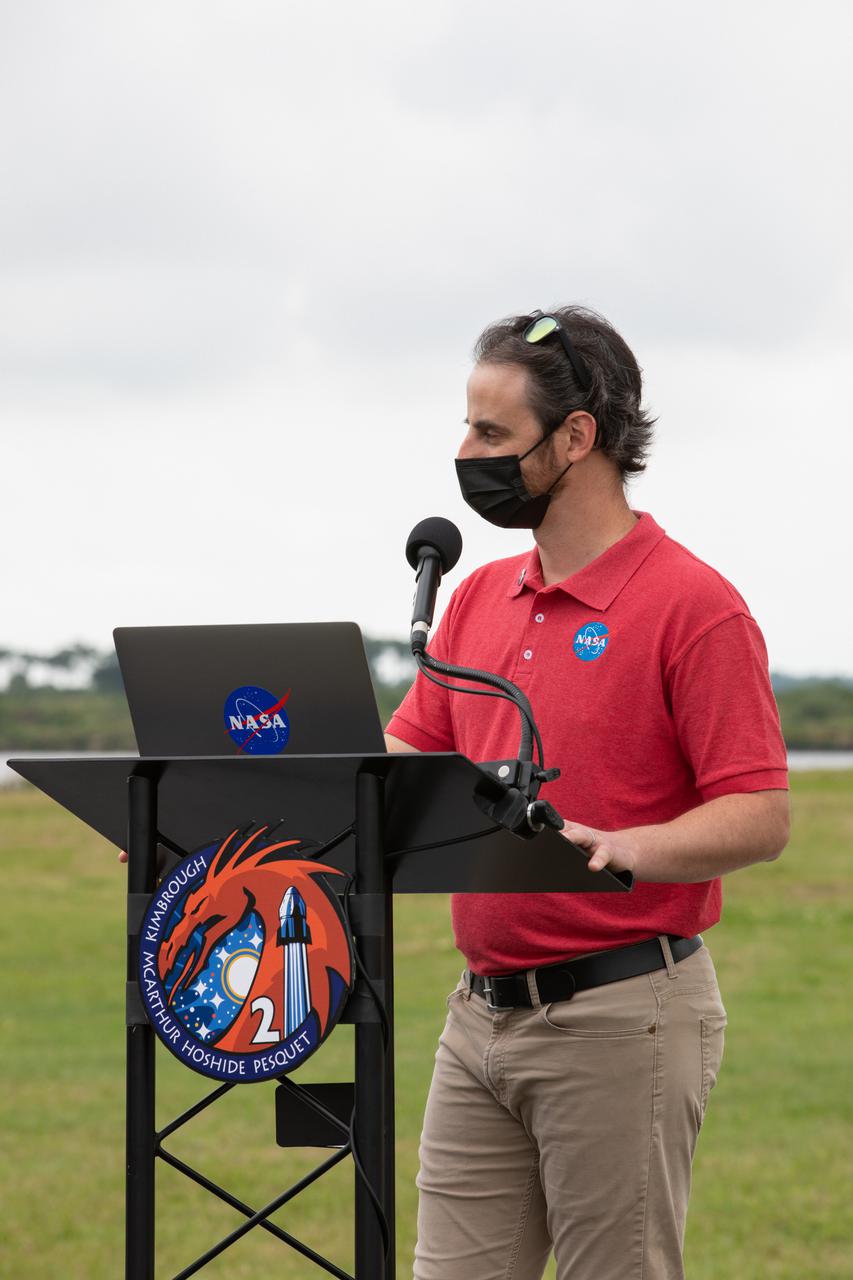 Moderator Joshua Santora speaks during a NASA Social Facebook Live event April 21, 2021, near the Press Site countdown clock at Kennedy Space Center in Florida, ahead of the agency’s SpaceX Crew-2 launch. NASA astronauts Shane Kimbrough and  Megan McArthur, JAXA astronaut Akihiko Hoshide, and ESA astronaut Thomas Pesquet will fly on Crew-2, the second crew rotation mission to the International Space Station as part of NASA’s Commercial Crew Program. They will launch aboard SpaceX’s Crew Dragon spacecraft, named Endeavour, powered by the company’s Falcon 9 rocket. Liftoff is set for Friday, April 23, at 5:49 a.m. EDT.