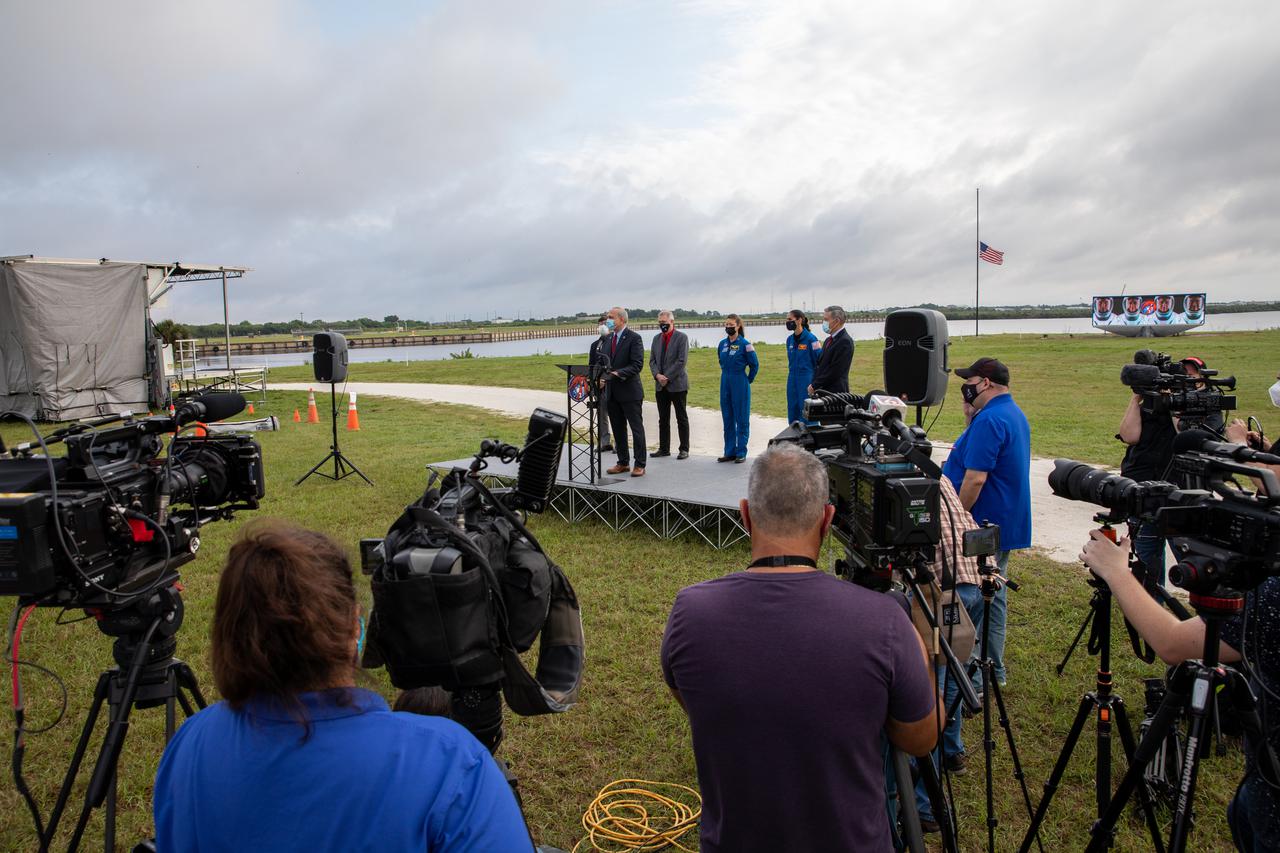 Members of the news media attend a press briefing April 21, 2021, near the Press Site countdown clock at NASA’s Kennedy Space Center in Florida ahead of the agency’s SpaceX Crew-2 launch. Crew-2 is the second regular crew mission of a U.S. commercial spacecraft with astronauts to the International Space Station as part of NASA’s Commercial Crew Program. The SpaceX Crew Dragon Endeavour capsule will launch atop the company’s Falcon 9 rocket from Launch Complex 39A to the space station for a six-month science mission. Liftoff is targeted for Friday, April 23, at 5:49 a.m. EDT.