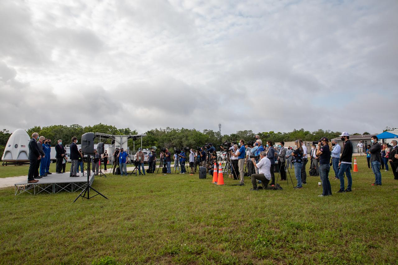Members of the news media attend a press briefing April 21, 2021, near the Press Site countdown clock at NASA’s Kennedy Space Center in Florida ahead of the agency’s SpaceX Crew-2 launch. Crew-2 is the second regular crew mission of a U.S. commercial spacecraft with astronauts to the International Space Station as part of NASA’s Commercial Crew Program. The SpaceX Crew Dragon Endeavour capsule will launch atop the company’s Falcon 9 rocket from Launch Complex 39A to the space station for a six-month science mission. Liftoff is targeted for Friday, April 23, at 5:49 a.m. EDT.