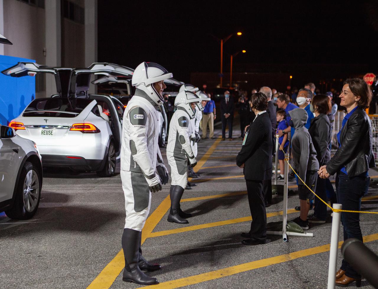 NASA SpaceX’s Crew-2 astronauts say goodbye to their families outside of the Neil Armstrong Operations and Checkout Building at NASA’s Kennedy Space Center in Florida on April 23, 2021. NASA astronauts Shane Kimbrough and Megan McArthur, ESA astronaut Thomas Pesquet, and JAXA astronaut Akihiko Hoshide will then board two Tesla vehicles for the trip to Kennedy’s Launch Complex 39A. Crew-2 is the second regular crew mission of a U.S. commercial spacecraft with astronauts to the International Space Station as part of NASA’s Commercial Crew Program. The SpaceX Crew Dragon Endeavour will launch atop the company’s Falcon 9 rocket from Pad 39A to the space station for a six-month science mission.