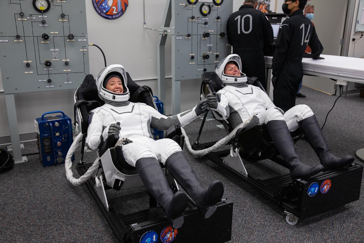 NASA astronauts Megan McArthur, left, and Shane Kimbrough are seated inside the crew suit-up room in the Neil Armstrong Operations and Checkout Building at NASA’s Kennedy Space Center in Florida, on April 23, 2021. McArthur and Kimbrough, along with ESA astronaut Thomas Pesquet and JAXA astronaut Akihiko Hoshide, will head to the International Space Station on NASA’s SpaceX Crew-2 mission. SpaceX’s Crew Dragon Endeavour will launch on the company’s Falcon 9 rocket from Kennedy’s Launch Complex 39A today at 5:49 a.m. EDT.