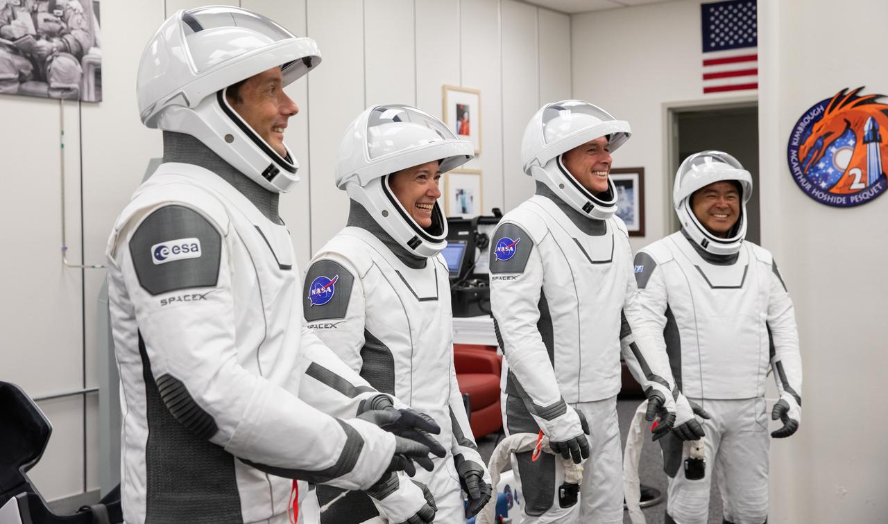 From left, ESA astronaut Thomas Pesquet, NASA astronaut Megan McArthur, NASA astronaut Shane Kimbrough and JAXA astronaut Akihiko Hoshide share a laugh inside the crew suit-up room in the Neil Armstrong Operations and Checkout Building at NASA’s Kennedy Space Center in Florida, on April 23, 2021. The four astronauts will head to the International Space Station on NASA’s SpaceX Crew-2 mission. SpaceX’s Crew Dragon Endeavour will launch on the company’s Falcon 9 rocket from Kennedy’s Launch Complex 39A today at 5:49 a.m. EDT.