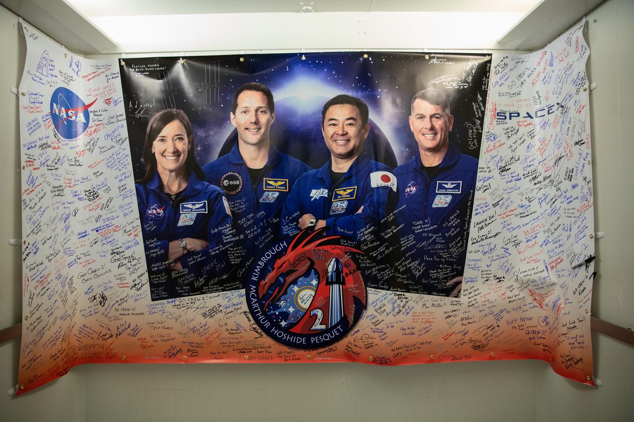 A signed banner hangs in the elevator inside the Astronaut Crew Quarters at the Neil Armstrong Operations and Checkout Building (O&C) at NASA’s Kennedy Space Center in Florida on April 23, 2021. NASA astronauts Shane Kimbrough and Megan McArthur, along with JAXA astronaut Akihiko Hoshide and ESA astronaut Thomas Pesquet, will exit the O&C and board two Tesla vehicles for the trip to Launch Complex 39A. Crew-2 is the second regular crew mission of a U.S. commercial spacecraft with astronauts to the International Space Station as part of NASA’s Commercial Crew Program. The SpaceX Crew Dragon Endeavour will launch atop the company’s Falcon 9 rocket from Pad 39A to the space station for a six-month science mission.