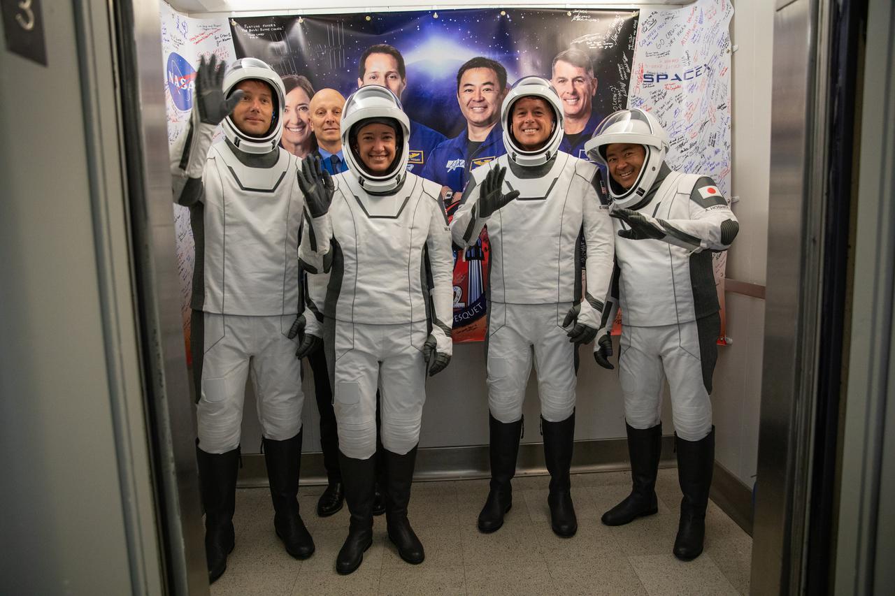 From left, ESA astronaut Thomas Pesquet, NASA astronaut Megan McArthur, NASA astronaut Shane Kimbrough and JAXA astronaut Akihiko Hoshide enter the elevator inside the Neil Armstrong Operations and Checkout Building at NASA’s Kennedy Space Center in Florida, on April 23, 2021. The four astronauts will head to the International Space Station on NASA’s SpaceX Crew-2 mission. SpaceX’s Crew Dragon Endeavour will launch on the company’s Falcon 9 rocket from Kennedy’s Launch Complex 39A today at 5:49 a.m. EDT. 