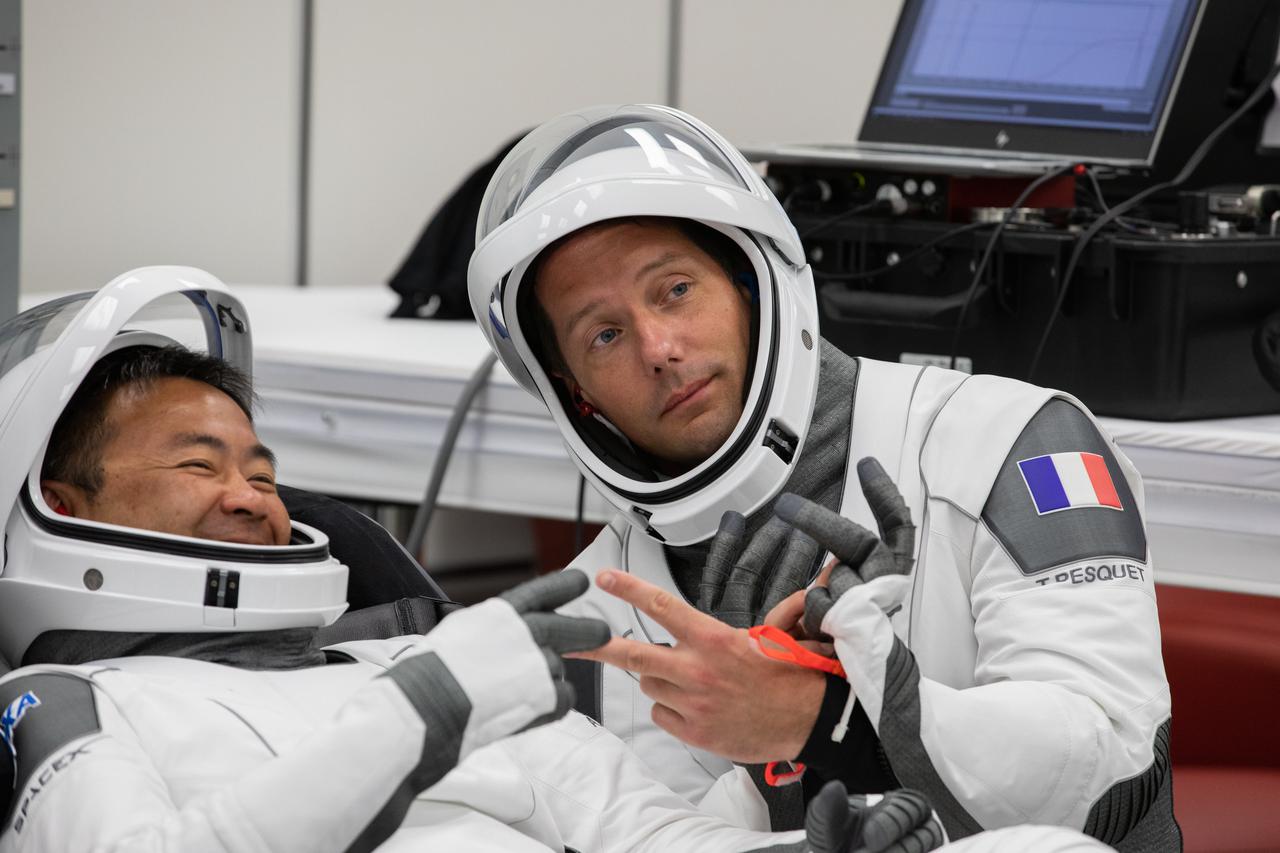 From left, JAXA astronaut Akihiko Hoshide and ESA astronaut Thomas Pesquet relax inside the crew suit-up room in the Neil Armstrong Operations and Checkout Building at NASA’s Kennedy Space Center in Florida, on April 23, 2021. NASA astronauts Shane Kimbrough and Megan McArthur will join Hoshide and Pesquet in heading to the International Space Station on NASA’s SpaceX Crew-2 mission. SpaceX’s Crew Dragon Endeavour will launch on the company’s Falcon 9 rocket from Kennedy’s Launch Complex 39A today at 5:49 a.m. EDT.