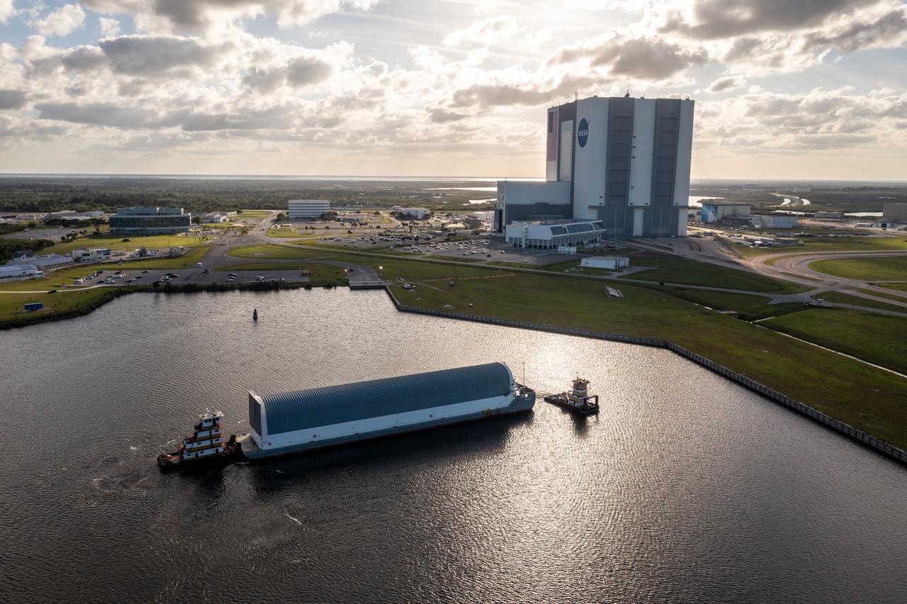 The Pegasus barge, carrying the mighty Space Launch System (SLS) core stage, arrives at NASA’s Kennedy Space Center in Florida on April 27, 2021, after journeying from the agency’s Stennis Space Center in Mississippi. The core stage is the final piece of Artemis hardware to arrive at the spaceport and will be offloaded and moved to Kennedy’s Vehicle Assembly Building, where it will be prepared for integration atop the mobile launcher with the completed stack of solid rocket boosters ahead of the Artemis I launch. The first in a series of increasingly complex missions, Artemis I will test SLS and Orion as an integrated system prior to crewed flights to the Moon.