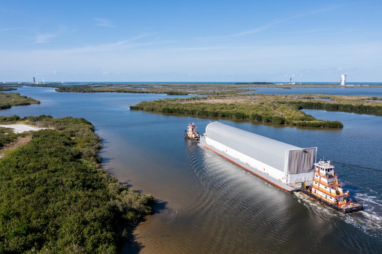 The Pegasus barge, carrying the mighty Space Launch System (SLS) core stage, arrives at NASA’s Kennedy Space Center in Florida on April 27, 2021, after journeying from the agency’s Stennis Space Center in Mississippi. The core stage is the final piece of Artemis hardware to arrive at the spaceport and will be offloaded and moved to Kennedy’s Vehicle Assembly Building, where it will be prepared for integration atop the mobile launcher with the completed stack of solid rocket boosters ahead of the Artemis I launch. The first in a series of increasingly complex missions, Artemis I will test SLS and Orion as an integrated system prior to crewed flights to the Moon.