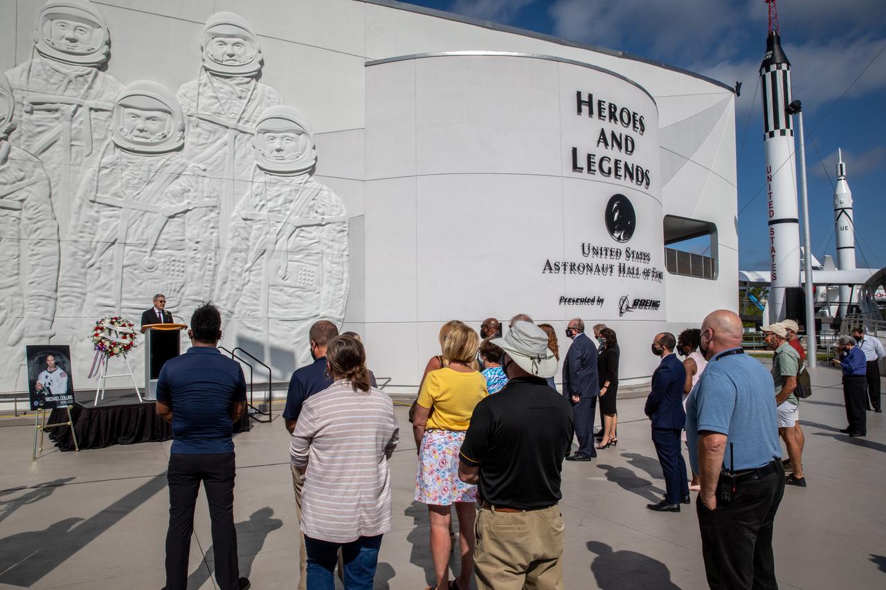 Kennedy Space Center Director Bob Cabana provides remarks during a wreath-laying ceremony in Florida, honoring the memory of former Apollo 11 astronaut Michael Collins on April 30, 2021. Therrin Protze, chief operating officer of Delaware North at Kennedy’s visitor complex, also spoke during the ceremony, held just outside of the Heroes and Legends exhibit at the visitor complex. Collins served as pilot on the three-day Gemini X mission in 1966, and he was the command module pilot for the historic Apollo 11 mission in 1969, where he remained in lunar orbit while Neil Armstrong and Buzz Aldrin become the first people to walk on the Moon. Collins passed away on April 28, 2021, at the age of 90.