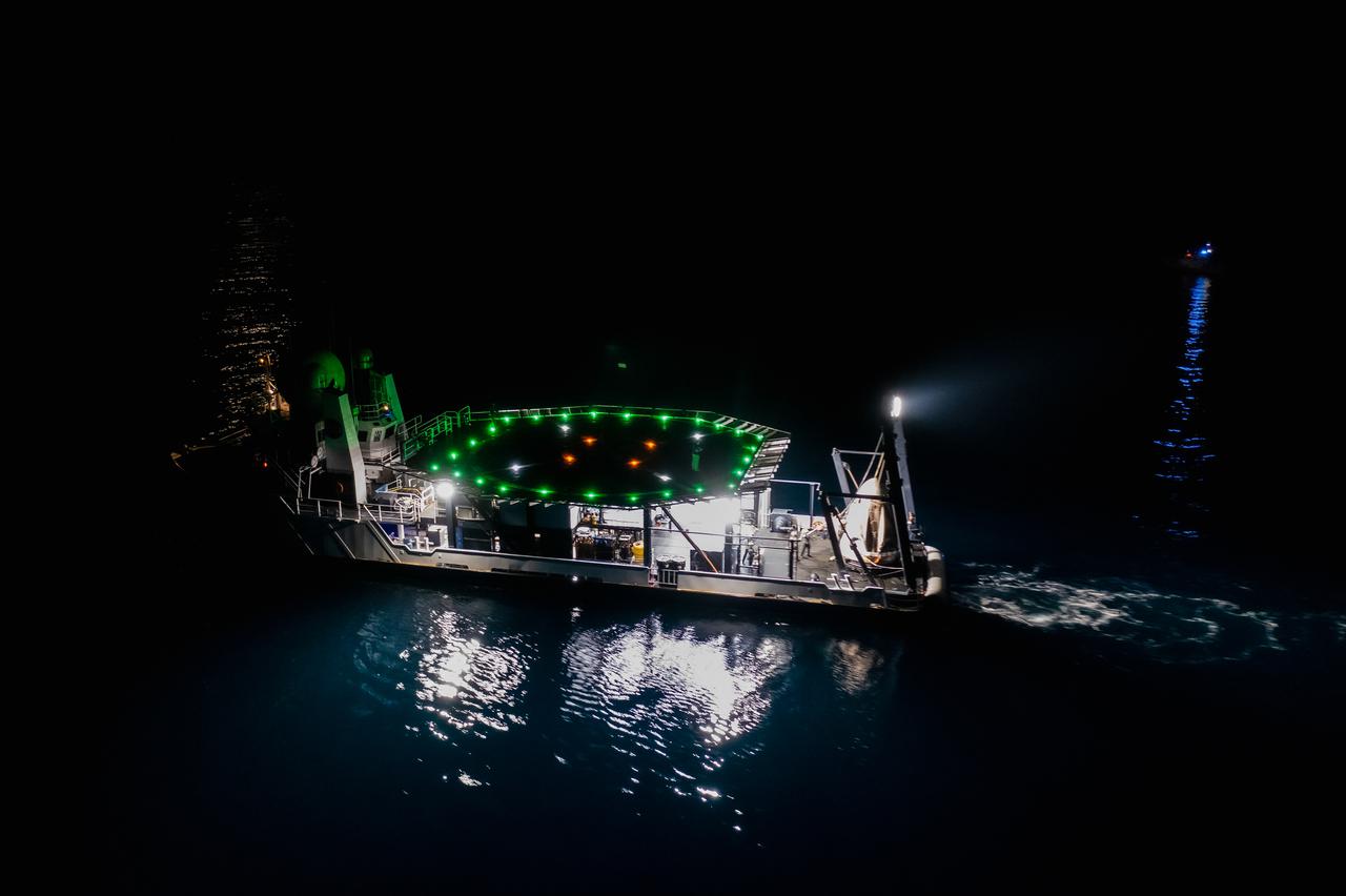 The SpaceX Crew Dragon Resilience splashed down in the Gulf of Mexico off the coast of Panama City, in Florida, at 2:56 a.m. EDT on May 2, 2021. Astronauts Michael Hopkins, Victor Glover, and Shannon Walker of NASA, and Soichi Noguchi of JAXA (Japan Aerospace Exploration Agency) completed Crew-1, the first crew rotation mission to the International Space Station in partnership with NASA as part of the agency’s Commercial Crew Program. Teams on the Go Navigator recovery ship, including two fast boats, work to secure and hoist Crew Dragon onto the main deck of the recovery ship with the astronauts inside.