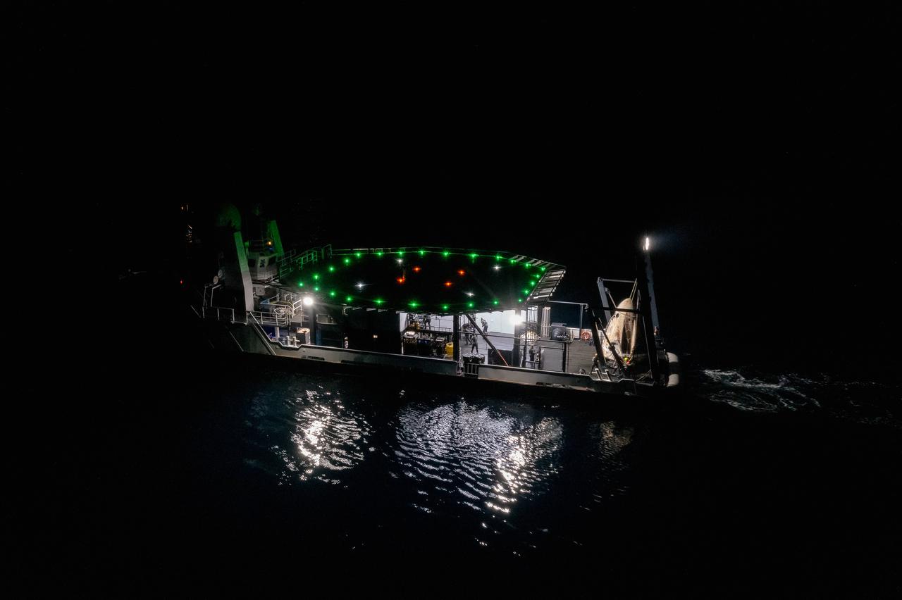 The SpaceX Crew Dragon Resilience splashed down in the Gulf of Mexico off the coast of Panama City, in Florida, at 2:56 a.m. EDT on May 2, 2021. Astronauts Michael Hopkins, Victor Glover, and Shannon Walker of NASA, and Soichi Noguchi of JAXA (Japan Aerospace Exploration Agency) completed Crew-1, the first crew rotation mission to the International Space Station in partnership with NASA as part of the agency’s Commercial Crew Program. Teams on the Go Navigator recovery ship, including two fast boats, work to secure and hoist Crew Dragon onto the main deck of the recovery ship with the astronauts inside.