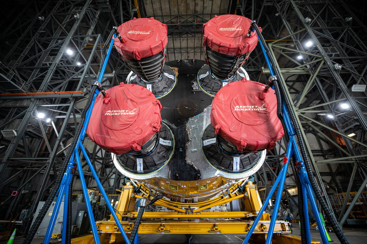 The Space Launch System (SLS) core stage for NASA’s Artemis I mission is in the transfer aisle of the Vehicle Assembly Building at Kennedy Space Center in Florida on May 5, 2021. In view are the core stage’s four RS-25 engines in protective covers. Teams from the center’s Exploration Ground Systems and contractor Jacobs will perform checkouts ahead of integrating the massive rocket stage with the twin solid rocket boosters, Orion spacecraft, and additional flight hardware ahead of the Artemis I launch. Artemis I will be the first integrated test of SLS and Orion and will pave the way for landing the first woman and first person of color on the lunar surface. It will be a proving ground for deep space exploration, leading the agency’s efforts under the Artemis program for a sustainable presence on the Moon and preparing for human missions to Mars. 