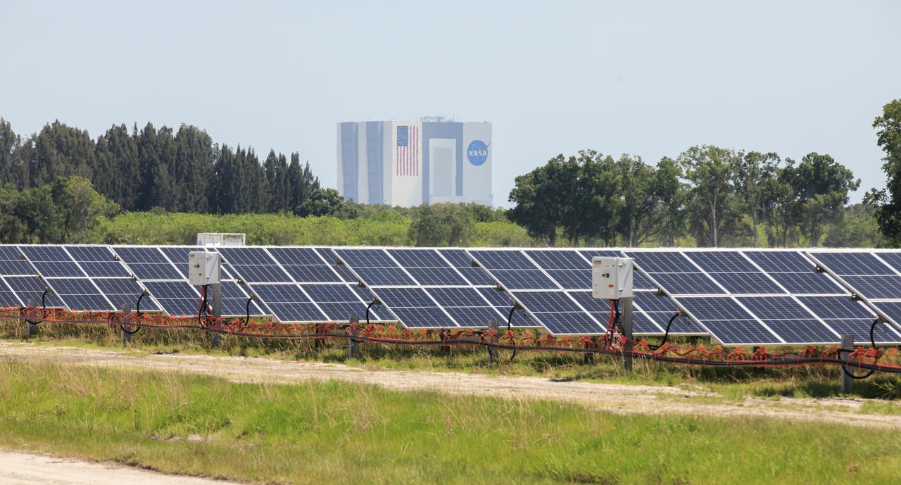 With the iconic Vehicle Assembly Building serving as the backdrop, a portion of the solar panels that make up Florida Power and Light’s (FPL) new Discovery Solar Energy Center is seen at NASA’s Kennedy Space Center in Florida. The 74.5-megawatt solar site spans 491 acres at Kennedy and contains about 250,000 solar panels. Harnessing energy from the Sun, the panels produce enough energy to power approximately 15,000 homes. The panels do not directly power anything at Kennedy, and instead, send energy directly to FPL’s electricity grid for distribution to existing customers. Construction began in spring 2020, and the energy center became fully operational on May 30, 2021.