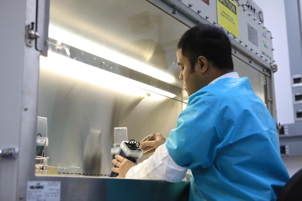 Dr. Arko Bakshi, a research associate with the Department of Botany at the University of Wisconsin, Madison, adds nutrient gel to Target Veggie Chambers, or TVCs, inside a laboratory in the Space Station Processing Facility at Kennedy Space Center in Florida on May 28, 2021. Bakshi waited until the gel solidified and then planted cotton seeds in it as part of the Targeting Improved Cotton Through Orbital Cultivation (TICTOC) experiment, which will launch to the International Space Station aboard SpaceX’s 22nd commercial resupply services mission. TICTOC will investigate how environmental factors and genes control development of roots in the absence of gravity. Liftoff of the SpaceX Falcon 9 rocket and Dragon capsule is scheduled for 1:29 p.m. EDT Thursday, June 3, 2021, from Launch Complex 39A at Kennedy Space Center. 