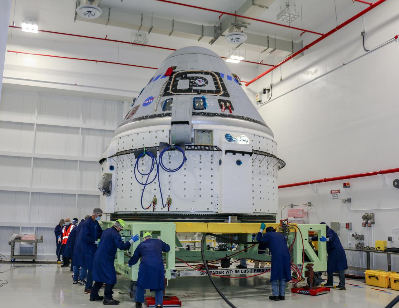 Technicians prepare Boeing’s CST-100 Starliner for the company’s Orbital Flight Test-2 (OFT-2) in the Commercial Crew and Cargo Processing Facility at NASA’s Kennedy Space Center in Florida on June 2. Part of the agency’s Commercial Crew Program, OFT-2 is a critical developmental milestone on the company’s path to fly crew missions for NASA.
