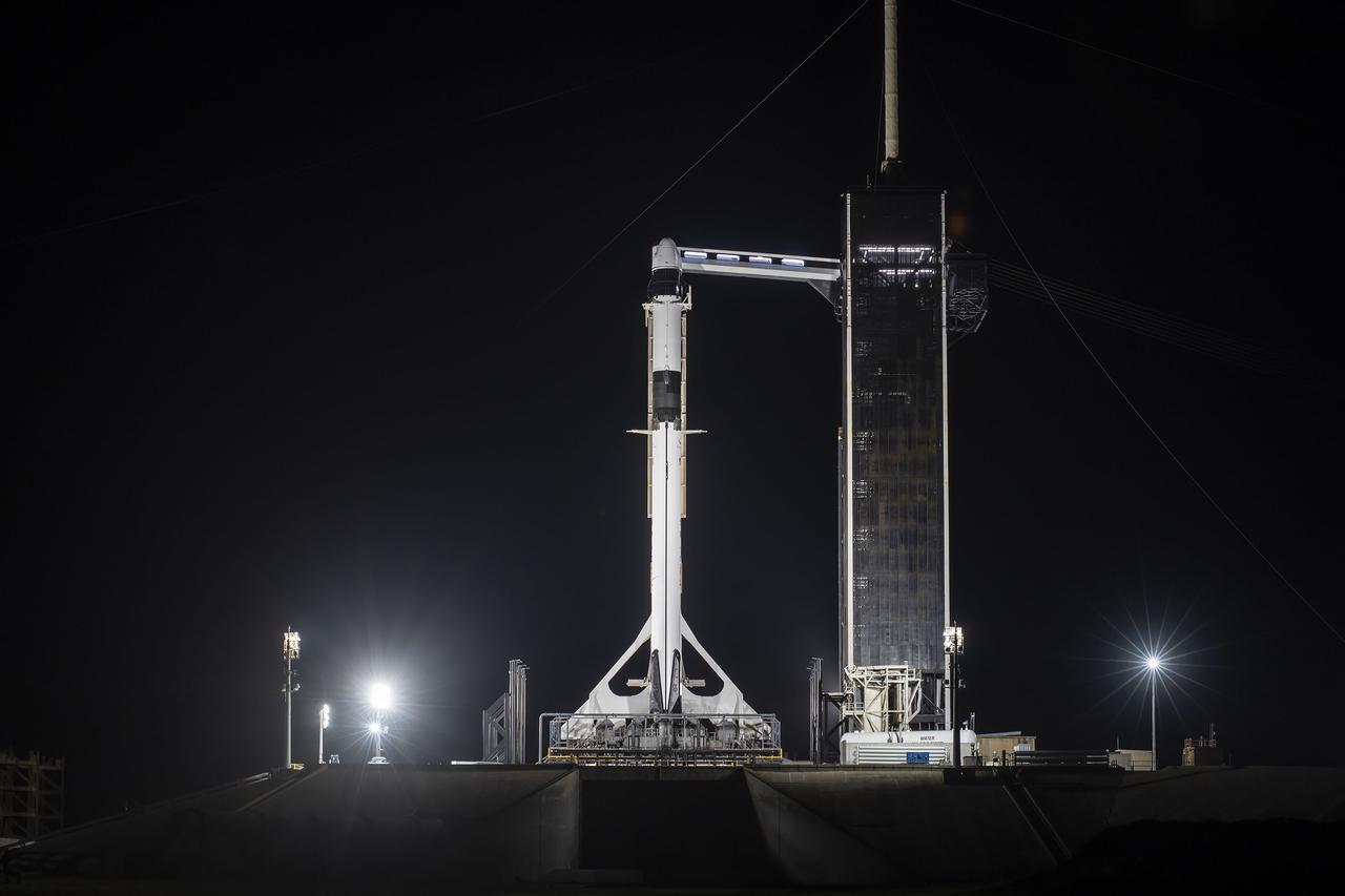 The SpaceX Falcon 9 rocket with the Dragon capsule atop is raised to the vertical position on June 2, 2021, at Launch Complex 39A at NASA’s Kennedy Space Center in Florida, in preparation for the company’s 22nd Commercial Resupply Services mission for NASA to the International Space Station. In view is the access arm. Dragon will deliver more than 7,300 pounds of cargo to the space station. Liftoff is scheduled for 1:29 p.m. EDT on Thursday, June 3. 