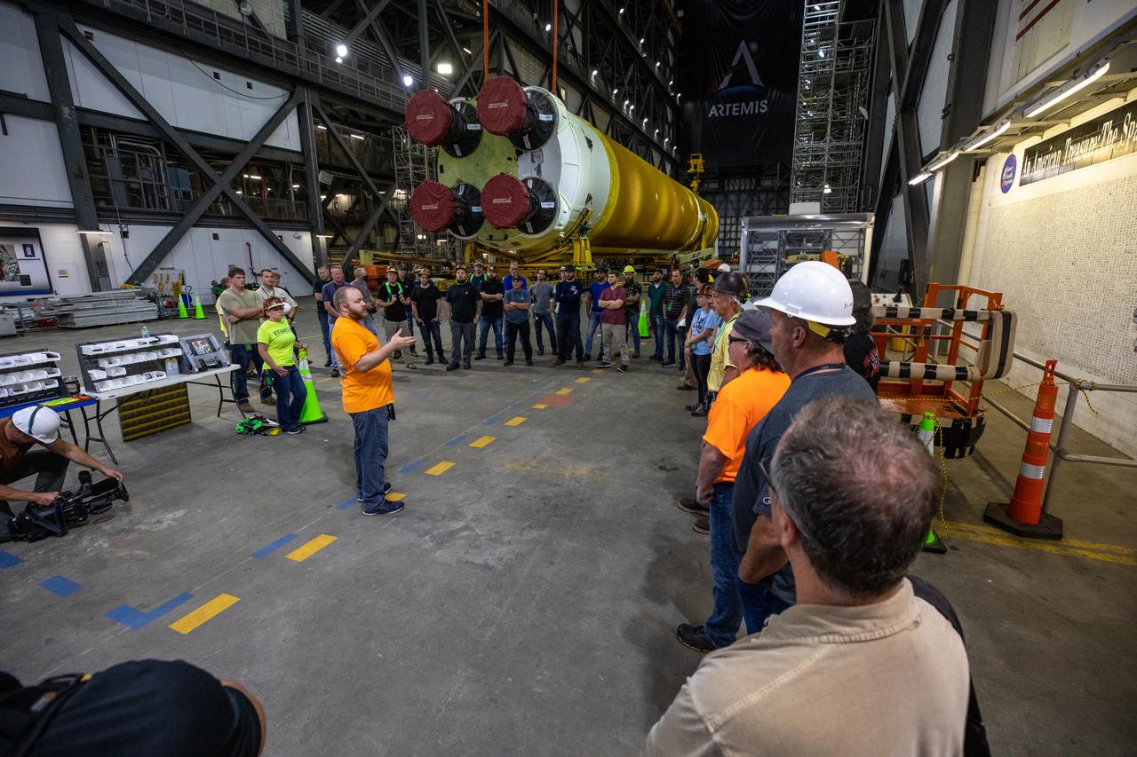 The Space Launch System (SLS) core stage is seen in the transfer aisle of the Vehicle Assembly Building (VAB) at NASA’s Kennedy Space Center in Florida on June 9, 2021. Teams with the agency’s Exploration Ground Systems and contractor Jacobs are preparing to lift the 188,000-pound core stage, which is the largest part of the rocket, and place it on the mobile launcher in between the two solid rocket boosters in High Bay 3 of the VAB. The core stage alone, with its four RS-25 engines, will provide more than 2 million pounds of thrust during launch and ascent, and coupled with the boosters, will provide more than 8.8 million pounds of thrust to send the Artemis I mission to space. The first in an increasingly complex series of missions, Artemis I will test SLS and the Orion spacecraft as an integrated system ahead of crewed flights to the Moon.
