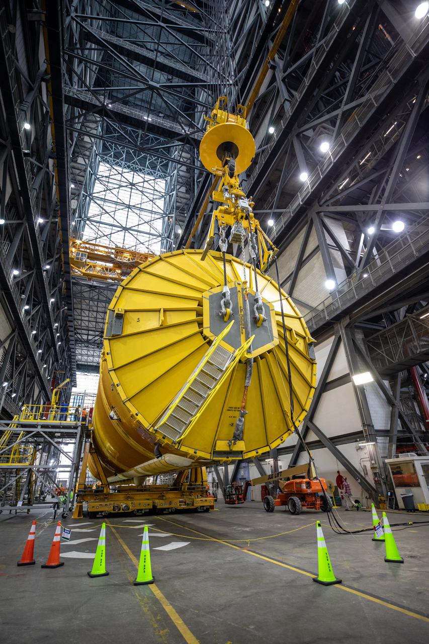 Teams with NASA’s Exploration Ground Systems and contractor Jacobs prepare to lift the Space Launch System (SLS) core stage and transfer it over to High Bay 3 in the Vehicle Assembly Building, where it will be placed atop the mobile launcher in between the twin solid rocket boosters, at NASA’s Kennedy Space Center in Florida on June 10, 2021. The 188,000-pound core stage, which is the largest part of the rocket, will provide more than 2 million pounds of thrust during launch and ascent, and coupled with the boosters, will provide more than 8.8 million pounds of thrust to send the Artemis I mission to space. The first in an increasingly complex series of missions, Artemis I will test SLS and the Orion spacecraft as an integrated system ahead of crewed flights to the Moon.