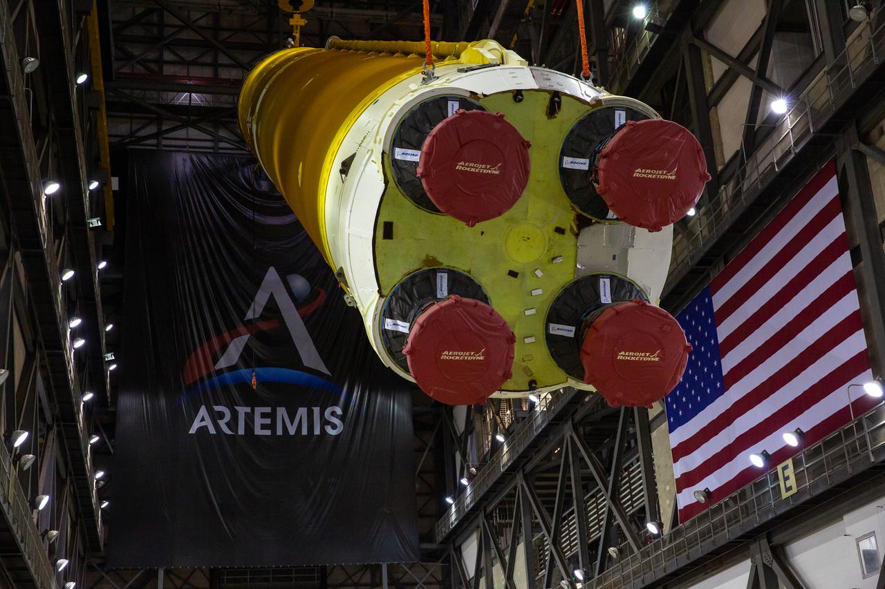 Teams with NASA’s Exploration Ground Systems and contractor Jacobs begin to rotate the Space Launch System (SLS) core stage – the largest part of the rocket – into a vertical position in preparation for its move to High Bay 3 in the Vehicle Assembly Building, where it will be placed atop the mobile launcher in between the twin solid rocket boosters, at NASA’s Kennedy Space Center in Florida on June 11, 2021. The 188,000-pound core stage, with its four RS-25 engines, will provide more than 2 million pounds of thrust during launch and ascent, and coupled with the boosters, will provide more than 8.8 million pounds of thrust to send the Artemis I mission to space. Under the Artemis program, NASA will land the first woman and first person of color on the Moon, as well as establish a sustainable presence on the lunar surface in preparation for human missions to Mars.