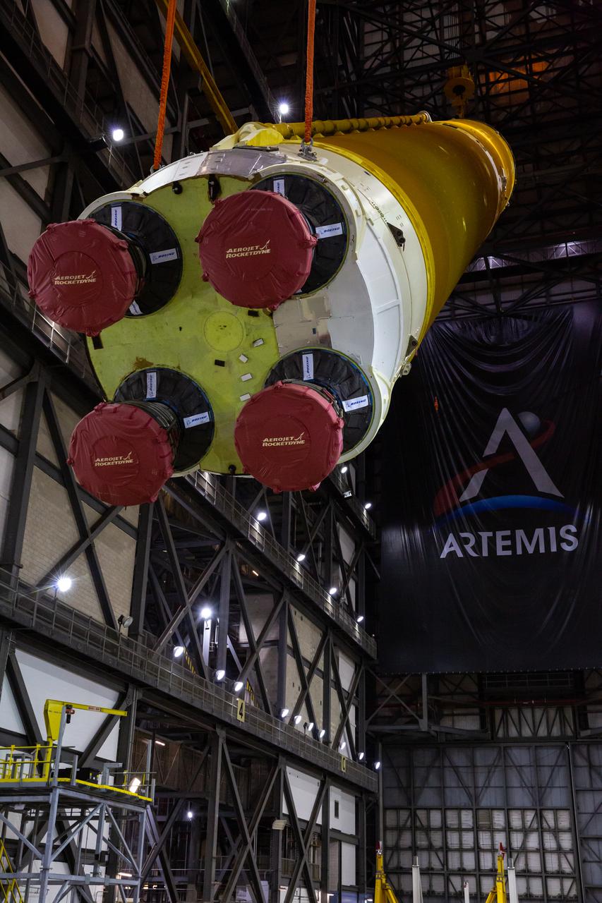 Teams with NASA’s Exploration Ground Systems and contractor Jacobs begin to rotate the Space Launch System (SLS) core stage – the largest part of the rocket – into a vertical position in preparation for its move to High Bay 3 in the Vehicle Assembly Building, where it will be placed atop the mobile launcher in between the twin solid rocket boosters, at NASA’s Kennedy Space Center in Florida on June 11, 2021. The 188,000-pound core stage, with its four RS-25 engines, will provide more than 2 million pounds of thrust during launch and ascent, and coupled with the boosters, will provide more than 8.8 million pounds of thrust to send the Artemis I mission to space. Under the Artemis program, NASA will land the first woman and first person of color on the Moon, as well as establish a sustainable presence on the lunar surface in preparation for human missions to Mars.