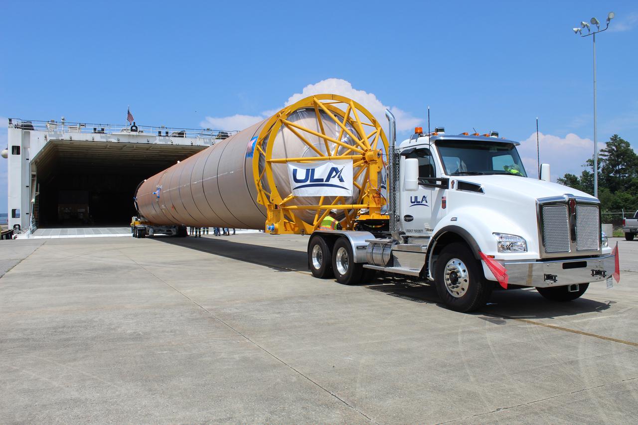 A United Launch Alliance (ULA) Atlas V booster for Boeing's CST-100 Starliner Crew Flight Test (CFT) is loaded onto a rocket-delivery ship at ULA’s manufacturing factory in Decatur, Alabama, on June 11, 2021, to begin its journey to Cape Canaveral, Florida. Starliner’s first flight with astronauts aboard, CFT will launch from Space Launch Complex 41 at Cape Canaveral Space Force Station in Florida. The flight test will demonstrate the ability of the Atlas V and Starliner to safely carry astronauts to and from the International Space Station for the agency’s Commercial Crew Program.