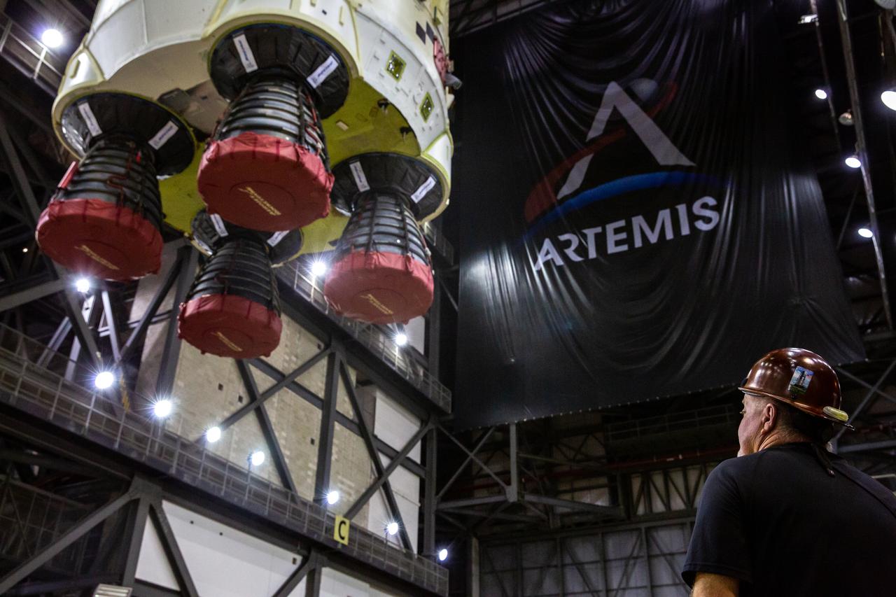 Teams with NASA’s Exploration Ground Systems and contractor Jacobs lift the Space Launch System (SLS) core stage – the largest part of the rocket – and prepare to move it over to High Bay 3 in the Vehicle Assembly Building, where it will be placed atop the mobile launcher in between the twin solid rocket boosters, at NASA’s Kennedy Space Center in Florida on June 12, 2021. The 188,000-pound core stage, with its four RS-25 engines, will provide more than 2 million pounds of thrust during launch and ascent, and coupled with the boosters, will provide more than 8.8 million pounds of thrust to send the Artemis I mission to space. Under the Artemis program, NASA will land the first woman and first person of color on the Moon, as well as establish a sustainable presence on the lunar surface in preparation for human missions to Mars.