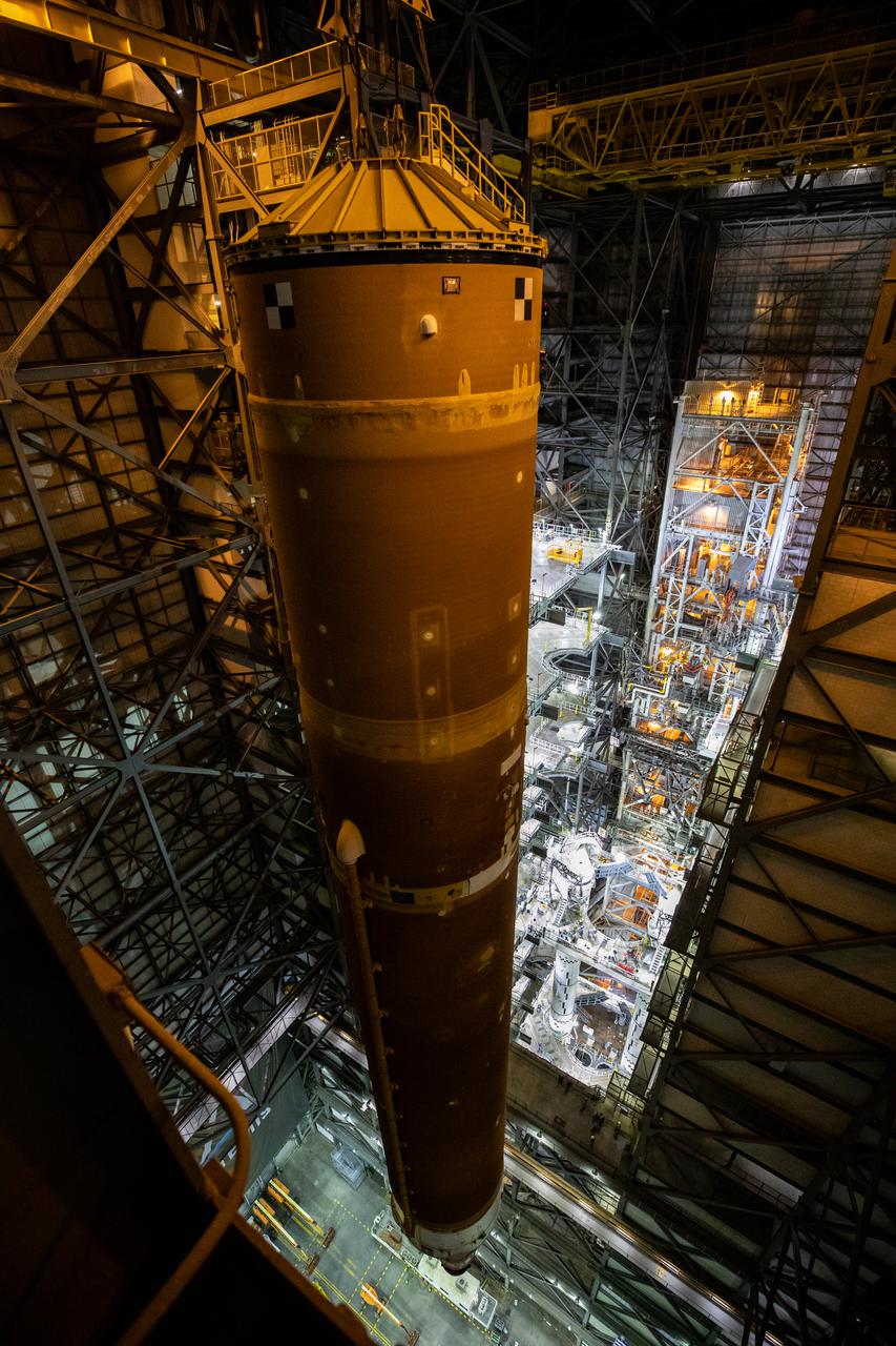 Teams with NASA’s Exploration Ground Systems and contractor Jacobs lift the Space Launch System (SLS) core stage – the largest part of the rocket – and prepare to move it over to High Bay 3 in the Vehicle Assembly Building, where it will be placed atop the mobile launcher in between the twin solid rocket boosters, at NASA’s Kennedy Space Center in Florida on June 12, 2021. The 188,000-pound core stage, with its four RS-25 engines, will provide more than 2 million pounds of thrust during launch and ascent, and coupled with the boosters, will provide more than 8.8 million pounds of thrust to send the Artemis I mission to space. Under the Artemis program, NASA will land the first woman and first person of color on the Moon, as well as establish a sustainable presence on the lunar surface in preparation for human missions to Mars. 