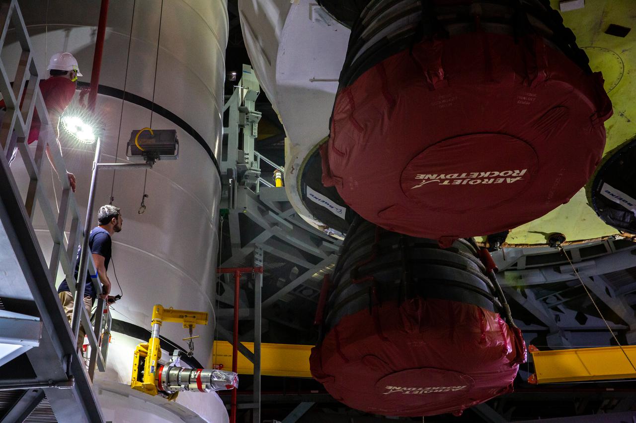 Seen here is a close-up view of the Space Launch System’s (SLS) RS-25 engines as teams with NASA’s Exploration Ground Systems and contractor Jacobs lower the core stage – the largest part of the rocket – onto the mobile launcher, in between the twin solid rocket boosters, inside High Bay 3 of the Vehicle Assembly Building at NASA’s Kennedy Space Center in Florida on June 12, 2021. The 188,000-pound core stage will provide more than 2 million pounds of thrust during launch and ascent, and coupled with the boosters, will provide more than 8.8 million pounds of thrust to send the Artemis I mission to space. Under the Artemis program, NASA will land the first woman and first person of color on the Moon, as well as establish a sustainable presence on the lunar surface in preparation for human missions to Mars.