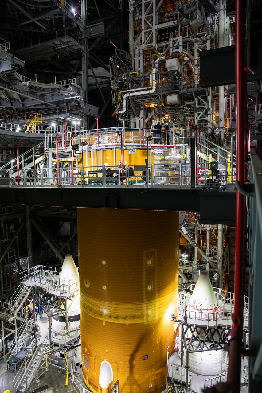 The Space Launch System (SLS) core stage is seen atop the mobile launcher inside High Bay 3 of the Vehicle Assembly Building at NASA’s Kennedy Space Center in Florida on June 15, 2021. Teams with NASA’s Exploration Ground Systems and contractor Jacobs lifted and lowered the core stage – the largest part of the rocket – onto the mobile launcher, placing it in between the twin solid rocket boosters. The 188,000-pound core stage, with its four RS-25 engines, will provide more than 2 million pounds of thrust during launch and ascent, and coupled with the boosters, will provide more than 8.8 million pounds of thrust to send the Artemis I mission to space. Under the Artemis program, NASA will land the first woman and first person of color on the Moon, as well as establish a sustainable presence on the lunar surface in preparation for human missions to Mars.