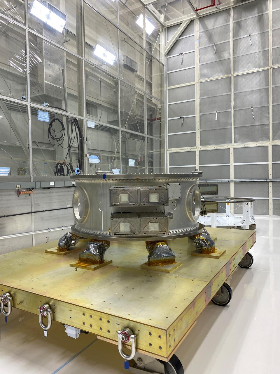 Mechanical and electrical support equipment for NASA’s Landsat 9 observatory arrive inside the Integrated Processing Facility at Vandenberg Space Force Base in California, on June 16, 2021. The equipment includes a secondary payload adapter and flight system for a group of microsat payloads, called CubeSats, that will launch with Landsat 9 as secondary payloads. Landsat 9 will launch on a United Launch Alliance Atlas V rocket from Space Launch Complex 3 at Vandenberg in September 2021. The launch is being managed by NASA’s Launch Services Program based at Kennedy Space Center, America’s multiuser spaceport. The Landsat 9 satellite will continue the nearly 50-year legacy of previous Landsat missions. It will monitor key natural and economic resources from orbit. Landsat 9 is managed by the agency’s Goddard Space Flight Center in Greenbelt, Maryland. The satellite will carry two instruments: the Operational Land Imager 2, which collects images of Earth’s landscapes in visible, near infrared and shortwave infrared light, and the Thermal Infrared Sensor 2, which measures the temperature of land surfaces. Like its predecessors, Landsat 9 is a joint mission between NASA and the U.S. Geological Survey.