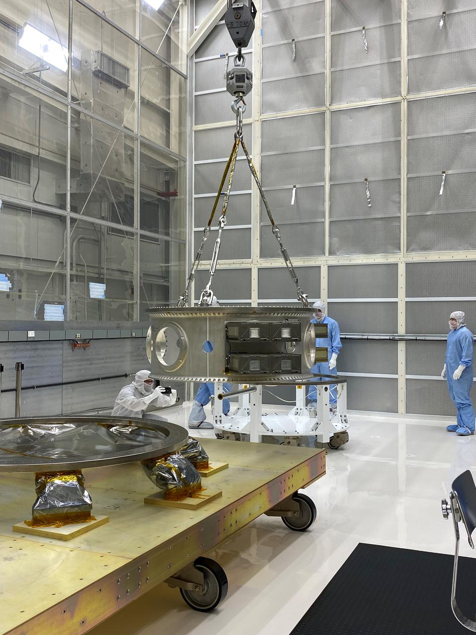 Technicians process mechanical and electrical support equipment for NASA’s Landsat 9 observatory inside the Integrated Processing Facility at Vandenberg Space Force Base in California, on June 16, 2021. The equipment includes a secondary payload adapter and flight system for a group of microsat payloads, called CubeSats, that will launch with Landsat 9 as secondary payloads. Landsat 9 will launch on a United Launch Alliance Atlas V rocket from Space Launch Complex 3 at Vandenberg in September 2021. The launch is being managed by NASA’s Launch Services Program based at Kennedy Space Center, America’s multiuser spaceport. The Landsat 9 satellite will continue the nearly 50-year legacy of previous Landsat missions. It will monitor key natural and economic resources from orbit. Landsat 9 is managed by the agency’s Goddard Space Flight Center in Greenbelt, Maryland. The satellite will carry two instruments: the Operational Land Imager 2, which collects images of Earth’s landscapes in visible, near infrared and shortwave infrared light, and the Thermal Infrared Sensor 2, which measures the temperature of land surfaces. Like its predecessors, Landsat 9 is a joint mission between NASA and the U.S. Geological Survey. 
