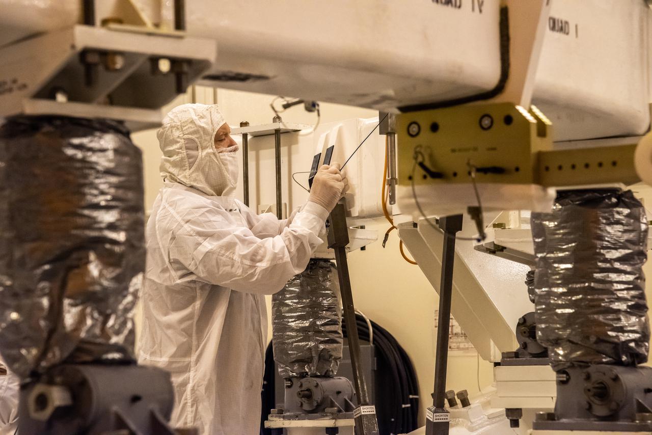 Inside the Integrated Processing Facility at Vandenberg Space Force Base in California, a United Launch Alliance (ULA) technician helps prepare the first half of the ULA Atlas V rocket payload fairing for NASA’s Landsat 9 satellite to be raised to the vertical position on June 18, 2021. The fairings will encapsulate the satellite for its launch atop the Atlas V from Vandenberg in September 2021. The launch is being managed by NASA’s Launch Services Program based at Kennedy Space Center in Florida. Landsat 9 will continue the nearly 50-year legacy of previous Landsat missions. It will monitor key natural and economic resources from orbit. Landsat 9 is managed by the agency’s Goddard Space Flight Center in Greenbelt, Maryland. It will carry two instruments: the Operational Land Imager 2, which collects images of Earth’s landscapes in visible, near-infrared and shortwave infrared light, and the Thermal Infrared Sensor 2, which measures the temperature of land surfaces. Like its predecessors, Landsat 9 is a joint mission between NASA and the U.S. Geological Survey.