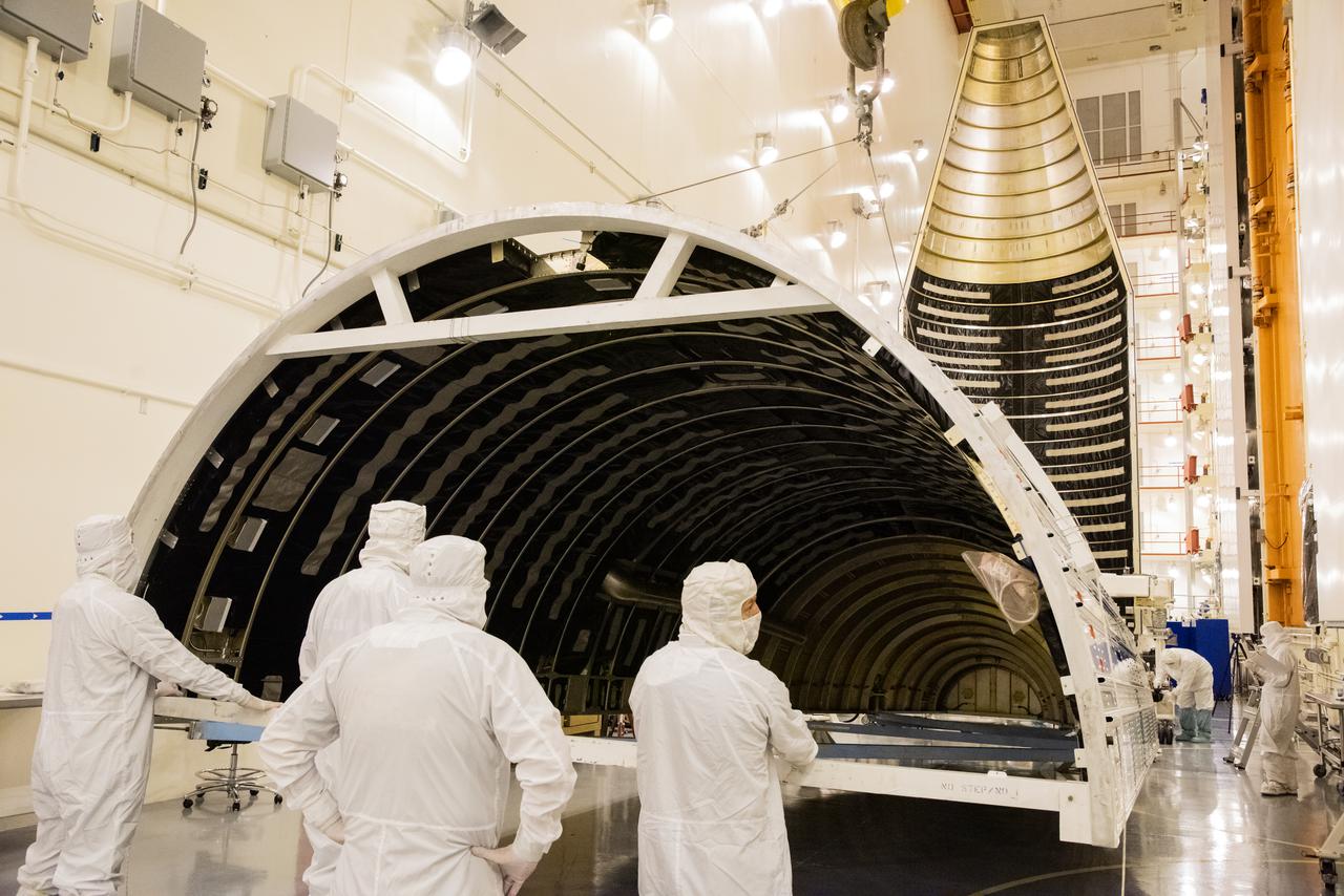 Preparations are underway to lift the second half of the United Launch Alliance Atlas V rocket payload fairing for NASA’s Landsat 9 satellite to the vertical position inside the Integrated Processing Facility at Vandenberg Space Force Base in California, on June 21, 2021. The fairings will encapsulate the satellite for its launch atop the Atlas V from Vandenberg in September 2021. The launch is being managed by NASA’s Launch Services Program based at Kennedy Space Center in Florida. Landsat 9 will continue the nearly 50-year legacy of previous Landsat missions. It will monitor key natural and economic resources from orbit. Landsat 9 is managed by the agency’s Goddard Space Flight Center in Greenbelt, Maryland. It will carry two instruments: the Operational Land Imager 2, which collects images of Earth’s landscapes in visible, near-infrared and shortwave infrared light, and the Thermal Infrared Sensor 2, which measures the temperature of land surfaces. Like its predecessors, Landsat 9 is a joint mission between NASA and the U.S. Geological Survey.