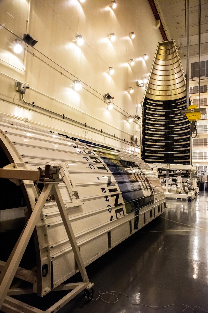 In the foreground inside the Integrated Processing Facility at Vandenberg Space Force Base in California, preparations are underway to lift the second half of the United Launch Alliance Atlas V payload fairings for NASA’s Landsat 9 satellite into the vertical position on June 21, 2021. In the background, the first half of the payload fairing was raised to vertical. The fairings will encapsulate the satellite for its launch atop the Atlas V from Vandenberg in September 2021. The launch is being managed by NASA’s Launch Services Program based at Kennedy Space Center in Florida. Landsat 9 will continue the nearly 50-year legacy of previous Landsat missions. It will monitor key natural and economic resources from orbit. Landsat 9 is managed by the agency’s Goddard Space Flight Center in Greenbelt, Maryland. It will carry two instruments: the Operational Land Imager 2, which collects images of Earth’s landscapes in visible, near-infrared and shortwave infrared light, and the Thermal Infrared Sensor 2, which measures the temperature of land surfaces. Like its predecessors, Landsat 9 is a joint mission between NASA and the U.S. Geological Survey.