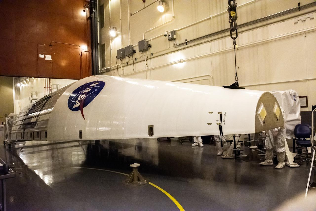 Inside the Integrated Processing Facility at Vandenberg Space Force Base in California, a crane is used to lift the second half of two United Launch Alliance Atlas V payload fairings for NASA’s Landsat 9 satellite into the vertical position on June 21, 2021. The fairings will encapsulate the satellite for its launch atop the Atlas V from Vandenberg in September 2021. The launch is being managed by NASA’s Launch Services Program based at Kennedy Space Center in Florida. Landsat 9 will continue the nearly 50-year legacy of previous Landsat missions. It will monitor key natural and economic resources from orbit. Landsat 9 is managed by the agency’s Goddard Space Flight Center in Greenbelt, Maryland. It will carry two instruments: the Operational Land Imager 2, which collects images of Earth’s landscapes in visible, near-infrared and shortwave infrared light, and the Thermal Infrared Sensor 2, which measures the temperature of land surfaces. Like its predecessors, Landsat 9 is a joint mission between NASA and the U.S. Geological Survey.