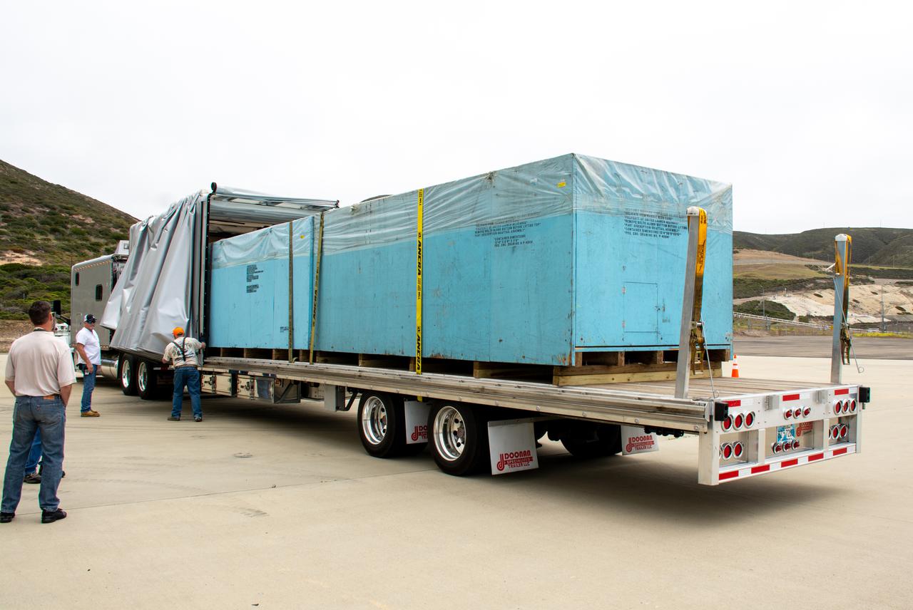 The United Launch Alliance (ULA) Atlas V payload fairing boattail for NASA’s Landsat 9 mission is transported by flatbed truck to the Horizontal Integration Facility at Vandenberg Space Force Base in California, on June 21, 2021. The boattail will shield the spacecraft from particles in the retrorocket plume during separation from the payload fairing. The Landsat 9 mission will launch atop a ULA Atlas V rocket from Vandenberg in September 2021. The launch is being managed by NASA’s Launch Services Program based at Kennedy Space Center. The Landsat 9 satellite will continue the nearly 50-year legacy of previous Landsat missions. It will monitor key natural and economic resources from orbit. Landsat 9 is managed by the agency’s Goddard Space Flight Center in Greenbelt, Maryland. The satellite will carry two instruments: the Operational Land Imager 2, which collects images of Earth’s landscapes in visible, near infrared and shortwave infrared light, and the Thermal Infrared Sensor 2, which measures the temperature of land surfaces. Like its predecessors, Landsat 9 is a joint mission between NASA and the U.S. Geological Survey. 