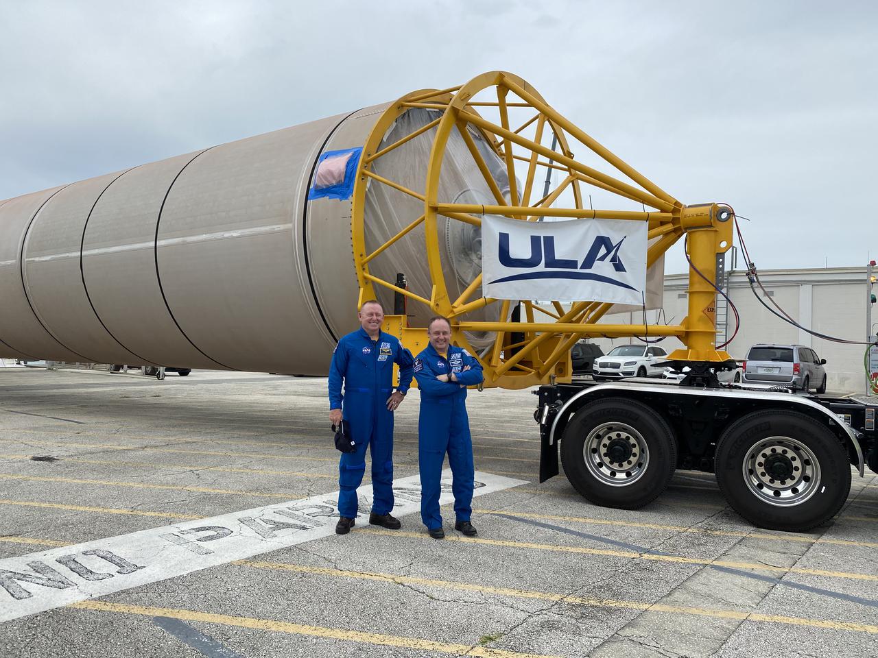 NASA astronauts Barry “Butch” Wilmore, left, Mike Fincke, right, welcome the United Launch Alliance (ULA) Atlas V rocket that will transport them and NASA astronaut Nicole Mann to the International Space Station on Boeing’s CST-100 Starliner spacecraft for the company’s Crew Flight Test (CFT). The Atlas V rocket arrived at Cape Canaveral Space Force Station (CCSFS), Florida on June 21, 2021, after its journey on a rocket-delivery ship from ULA’s manufacturing factory in Decatur, Alabama. Starliner’s first flight with astronauts aboard, CFT will launch from Space Launch Complex-41 at CCSFS. The flight test will demonstrate the ability of the Atlas V and Starliner to safely carry astronauts to and from the space station for the agency’s Commercial Crew Program.