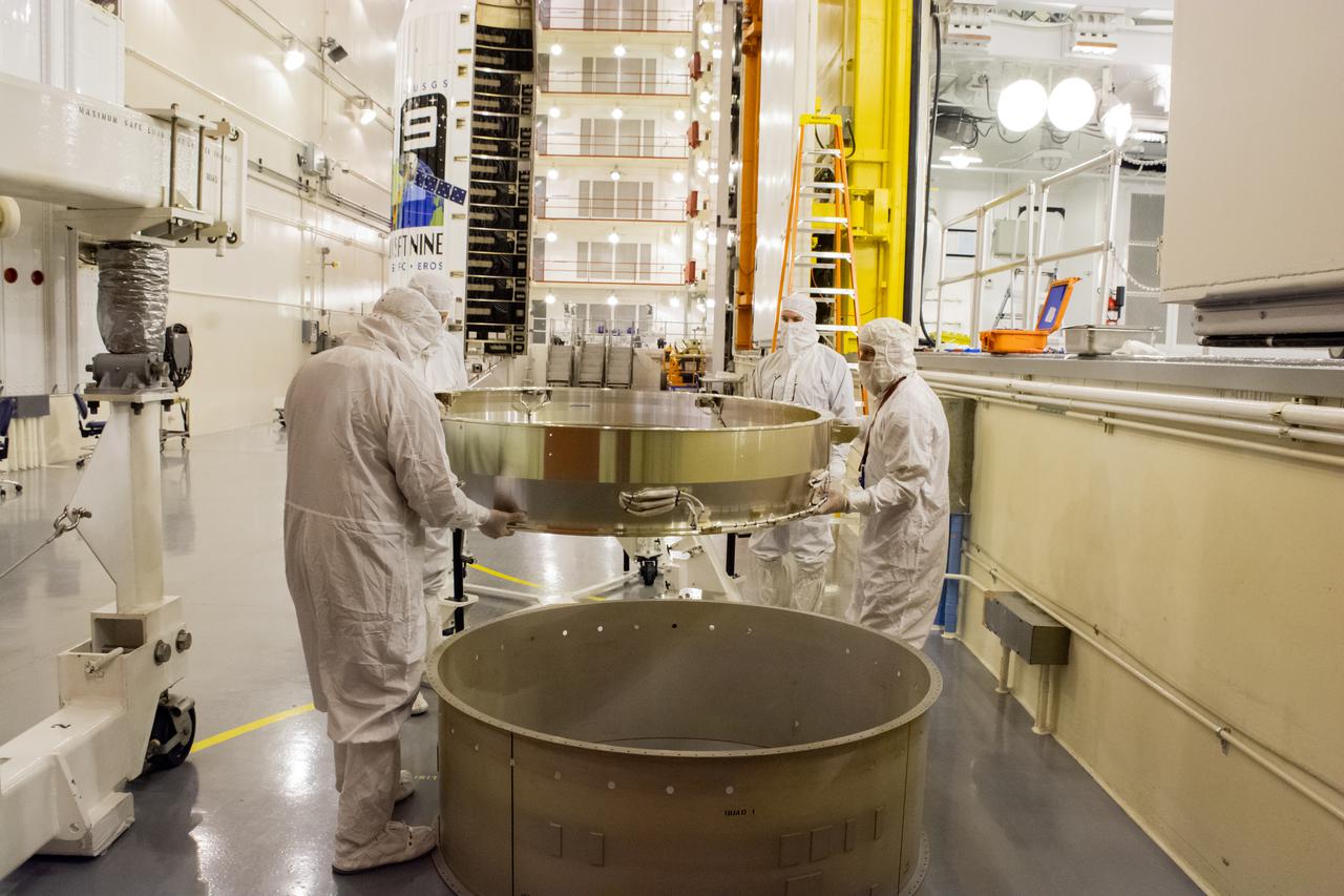 Inside the Integrated Processing Facility at Vandenberg Space Force Base in California, United Launch Alliance (ULA) technicians prepare to perform a blacklight test and sampling for contaminants on the two ULA Atlas V rocket payload fairings for NASA’s Landsat 9 satellite on June 23, 2021. The fairings will encapsulate the satellite for its launch atop the Atlas V from Vandenberg in September 2021. The launch is being managed by NASA’s Launch Services Program based at Kennedy Space Center in Florida. Landsat 9 will continue the nearly 50-year legacy of previous Landsat missions. It will monitor key natural and economic resources from orbit. Landsat 9 is managed by the agency’s Goddard Space Flight Center in Greenbelt, Maryland. It will carry two instruments: the Operational Land Imager 2, which collects images of Earth’s landscapes in visible, near-infrared and shortwave infrared light, and the Thermal Infrared Sensor 2, which measures the temperature of land surfaces. Like its predecessors, Landsat 9 is a joint mission between NASA and the U.S. Geological Survey.