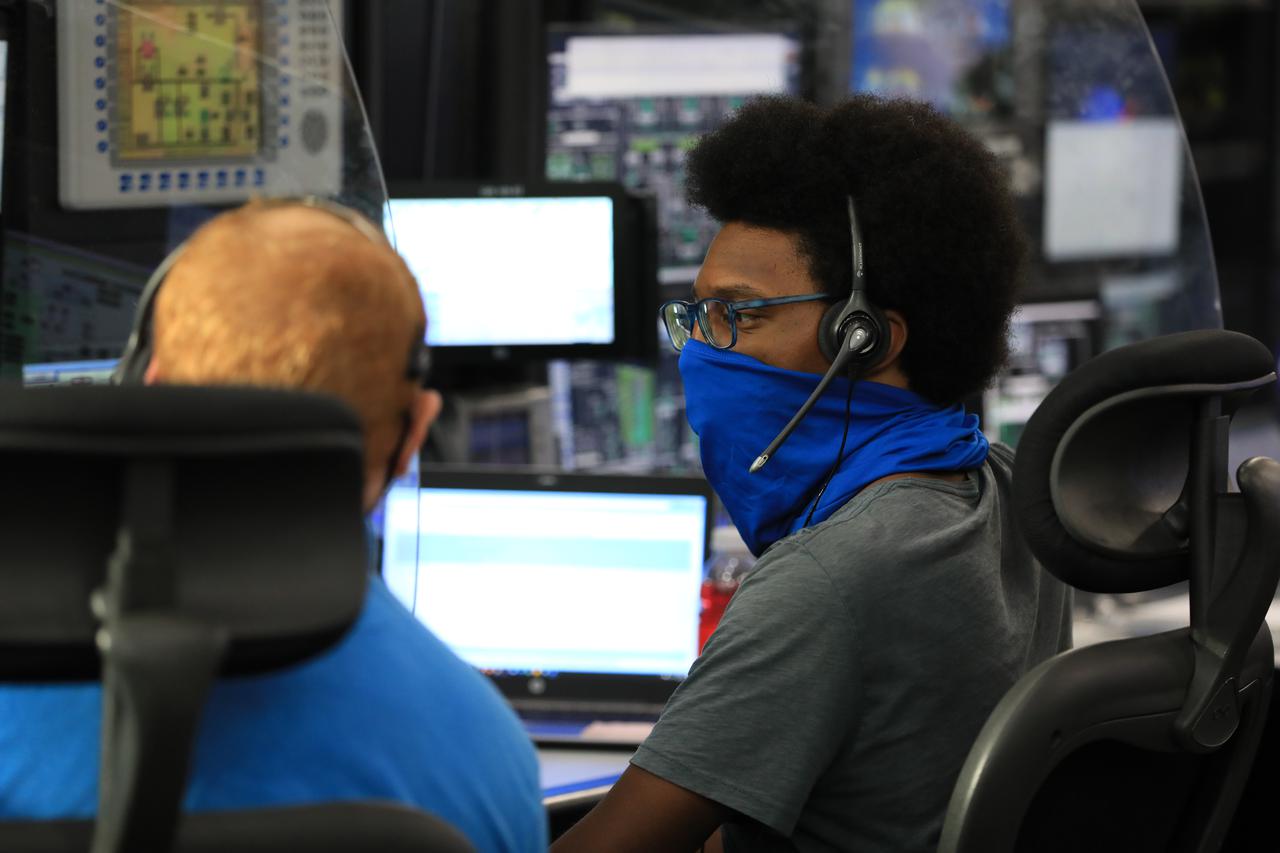Artemis I launch team member Joshua Jones monitors activities during the ninth formal terminal countdown simulation inside Firing Room 1 in the Launch Control Center at NASA’s Kennedy Space Center in Florida on June 24, 2021. The Artemis I launch team includes personnel with NASA’s Exploration Ground Systems (EGS) and contractor Jacobs. This is part of a series of simulations to help the team prepare for the launch of Artemis I, the uncrewed first flight of the Space Launch System rocket and Orion spacecraft.