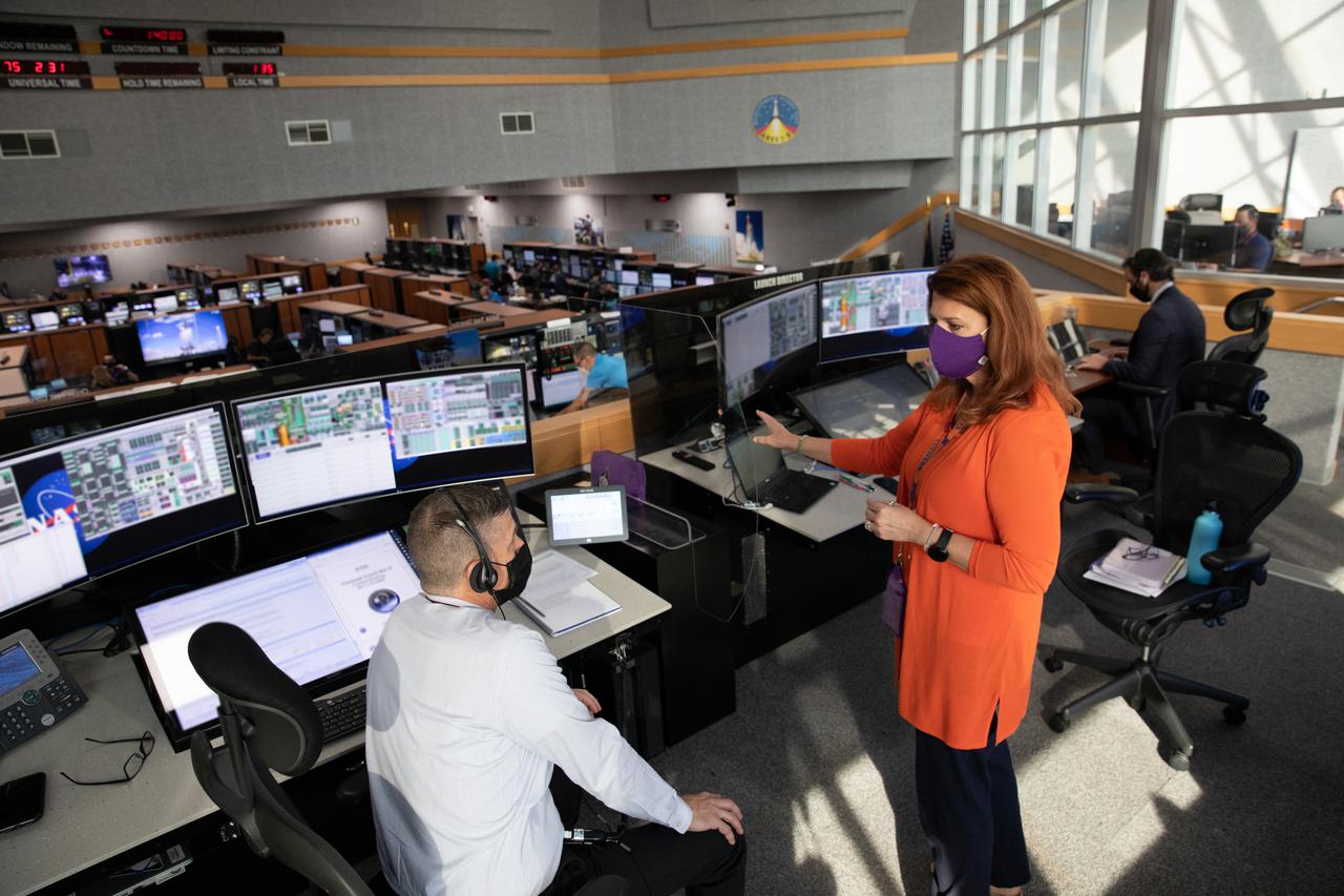 Chief of the Test, Launch and Recovery Operations Branch within the Exploration Ground Systems (EGS) Program Jeremy Graeber, (left) and Artemis I Launch Director Charlie Blackwell-Thompson (right), along with members of the Artemis I launch team, including personnel with EGS and contractor Jacobs, monitor activities during the ninth formal terminal countdown simulation inside Firing Room 1 in the Launch Control Center at NASA’s Kennedy Space Center in Florida on June 24, 2021. This is part of a series of simulations to help the team prepare for the launch of Artemis I, the uncrewed first flight of the Space Launch System rocket and Orion spacecraft.